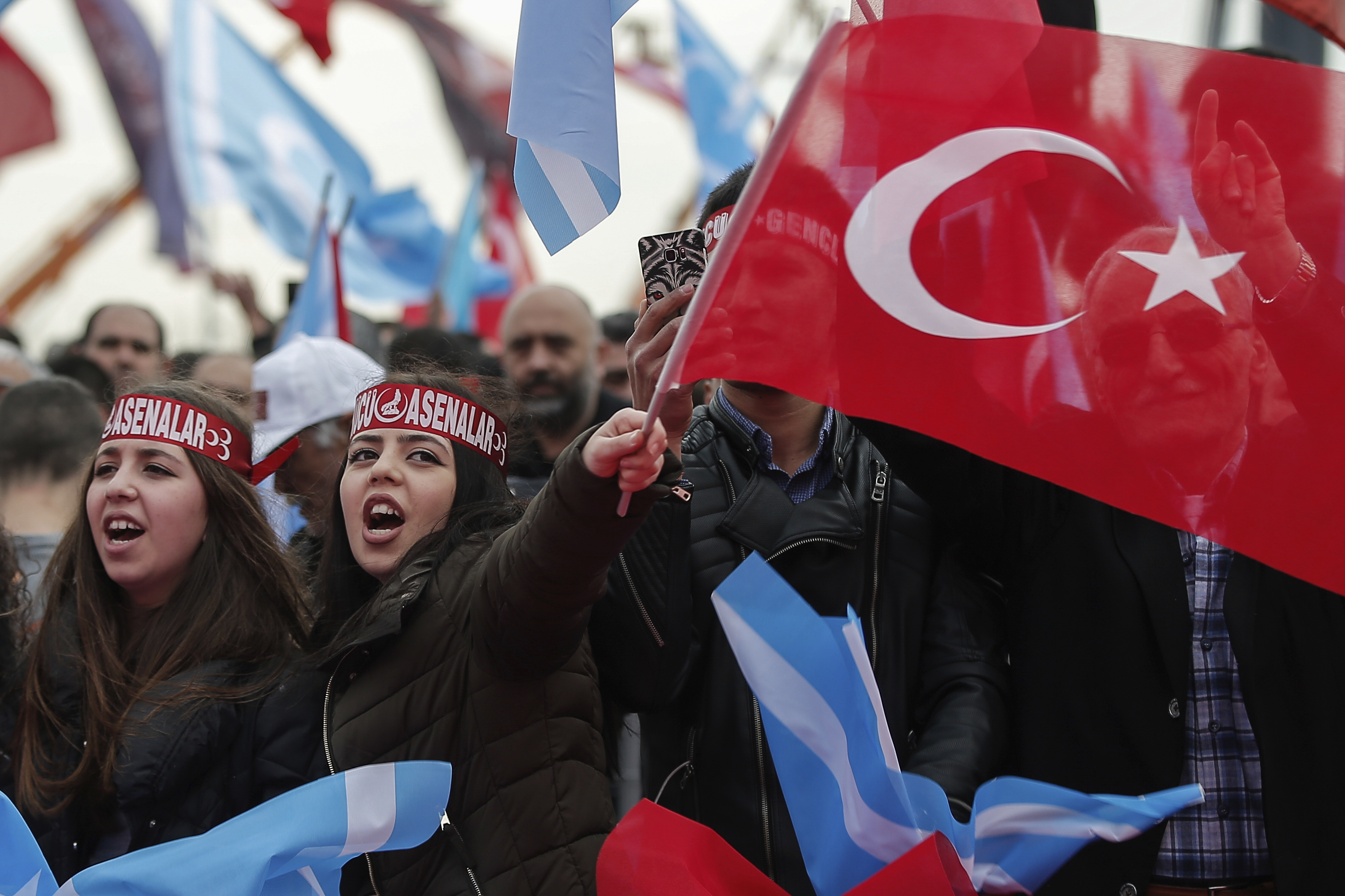 Supporters listen to Devlet Bahceli, the leader of Turkey's opposition Nationalist Movement Party, who supports President Recep Tayyip Erdogan, during a referendum rally in Istanbul, Sunday, April 9, 2017.  Turkey is heading to a contentious April 16 referendum on constitutional reforms to expand Erdogan's powers.(AP Photo/Emrah Gurel)