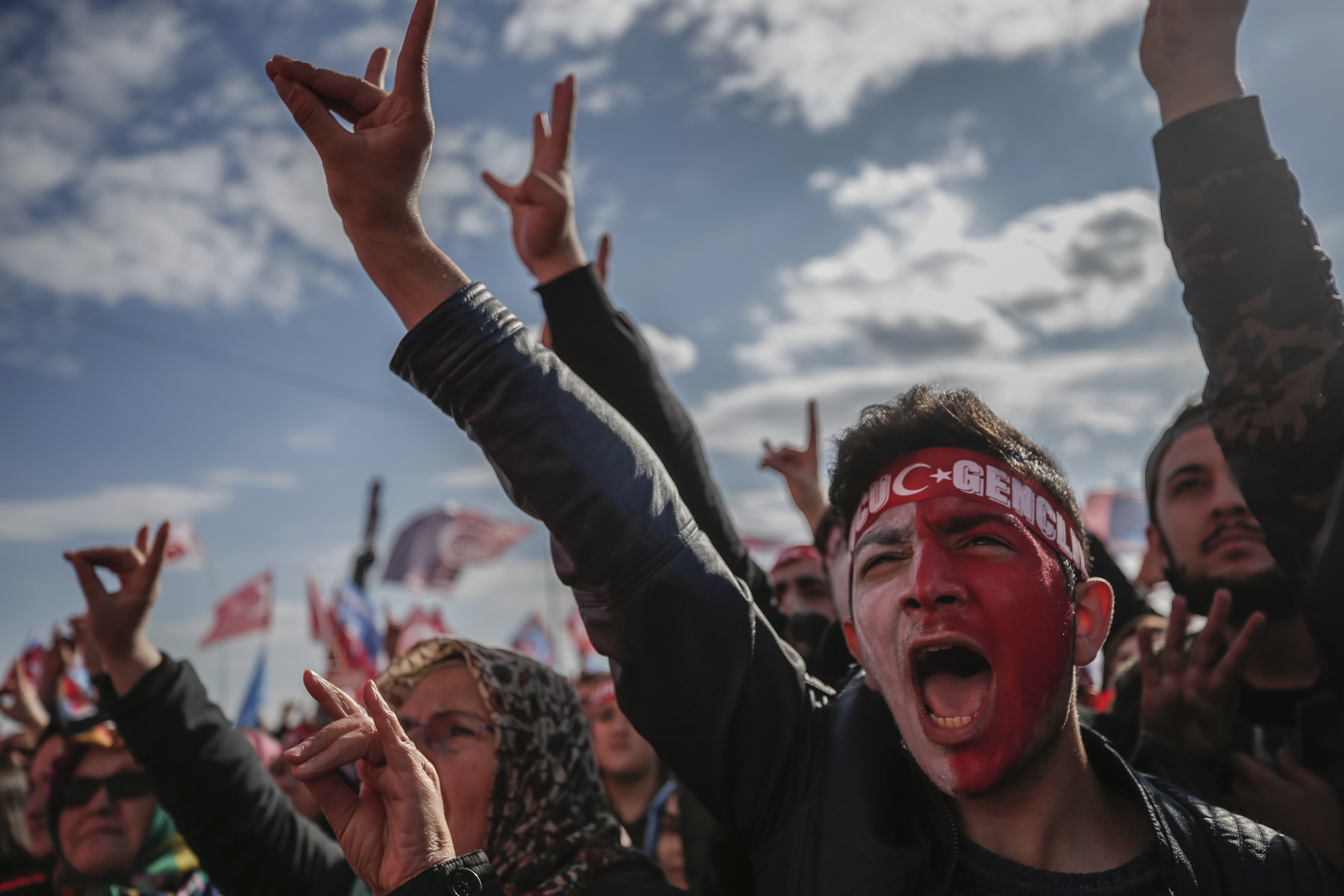 Supporters shout slogans as they listen to Devlet Bahceli, the leader of Turkey's opposition Nationalist Movement Party, who supports President Recep Tayyip Erdogan, during a referendum rally in Istanbul, Sunday, April 9, 2017. Turkey is heading to a contentious April 16 referendum on constitutional reforms to expand Erdogan's powers.(AP Photo/Emrah Gurel)