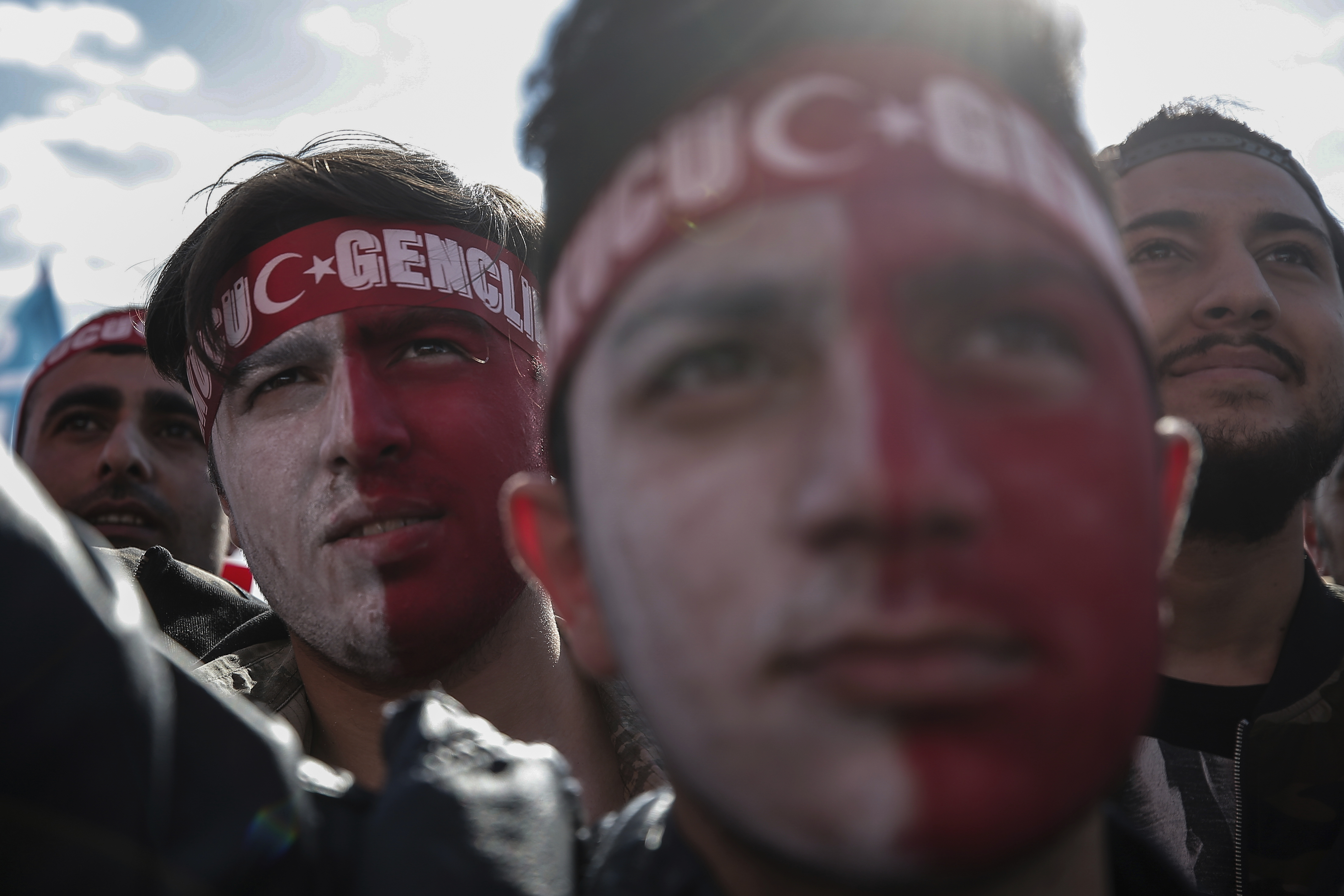 Supporters listen to Devlet Bahceli, the leader of Turkey's opposition Nationalist Movement Party, who supports President Recep Tayyip Erdogan, during a referendum rally in Istanbul, Sunday, April 9, 2017. Turkey is heading to a contentious April 16 referendum on constitutional reforms to expand Erdogan's powers.(AP Photo/Emrah Gurel)