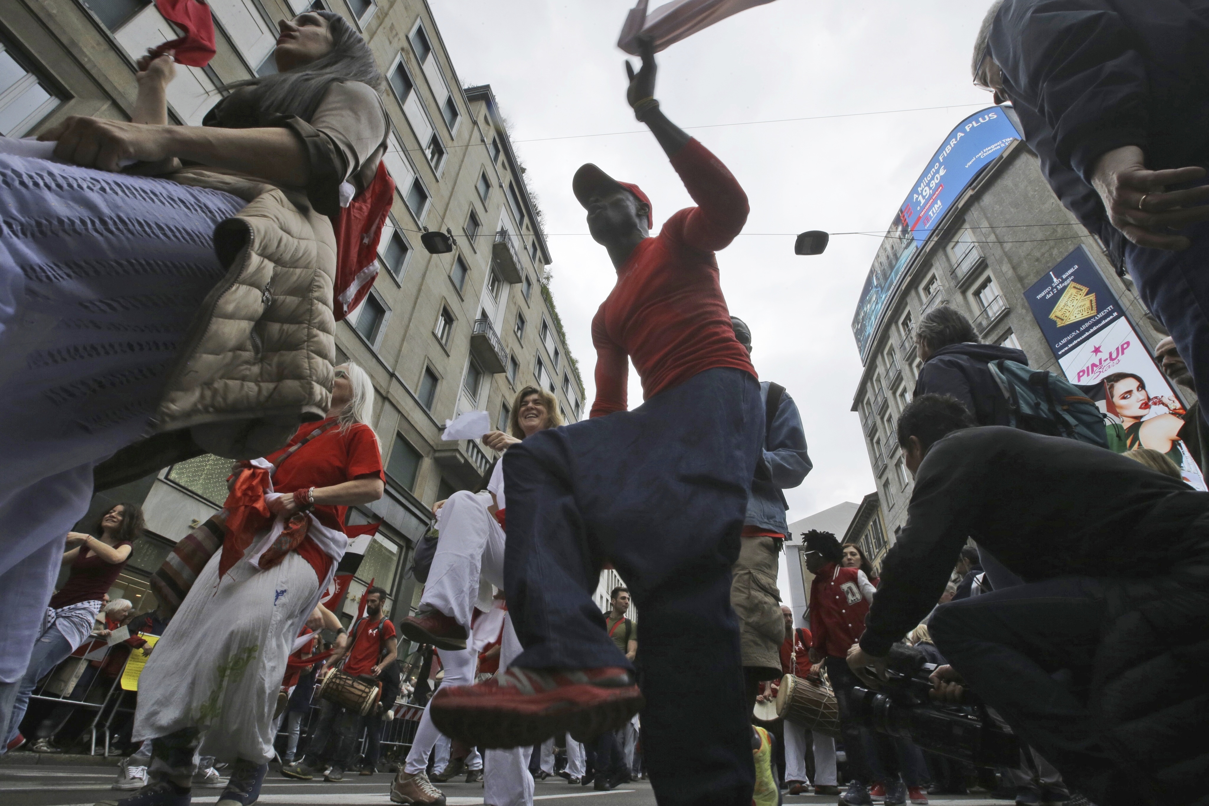 People march during a demonstration to mark Italy's Liberation day, in Milan, Italy, Tuesday, April 25, 2017. Italy is celebrating the anniversary of a partisan uprising against the Nazis and their Fascist allies at the end of World War II. (AP Photo/Luca Bruno)