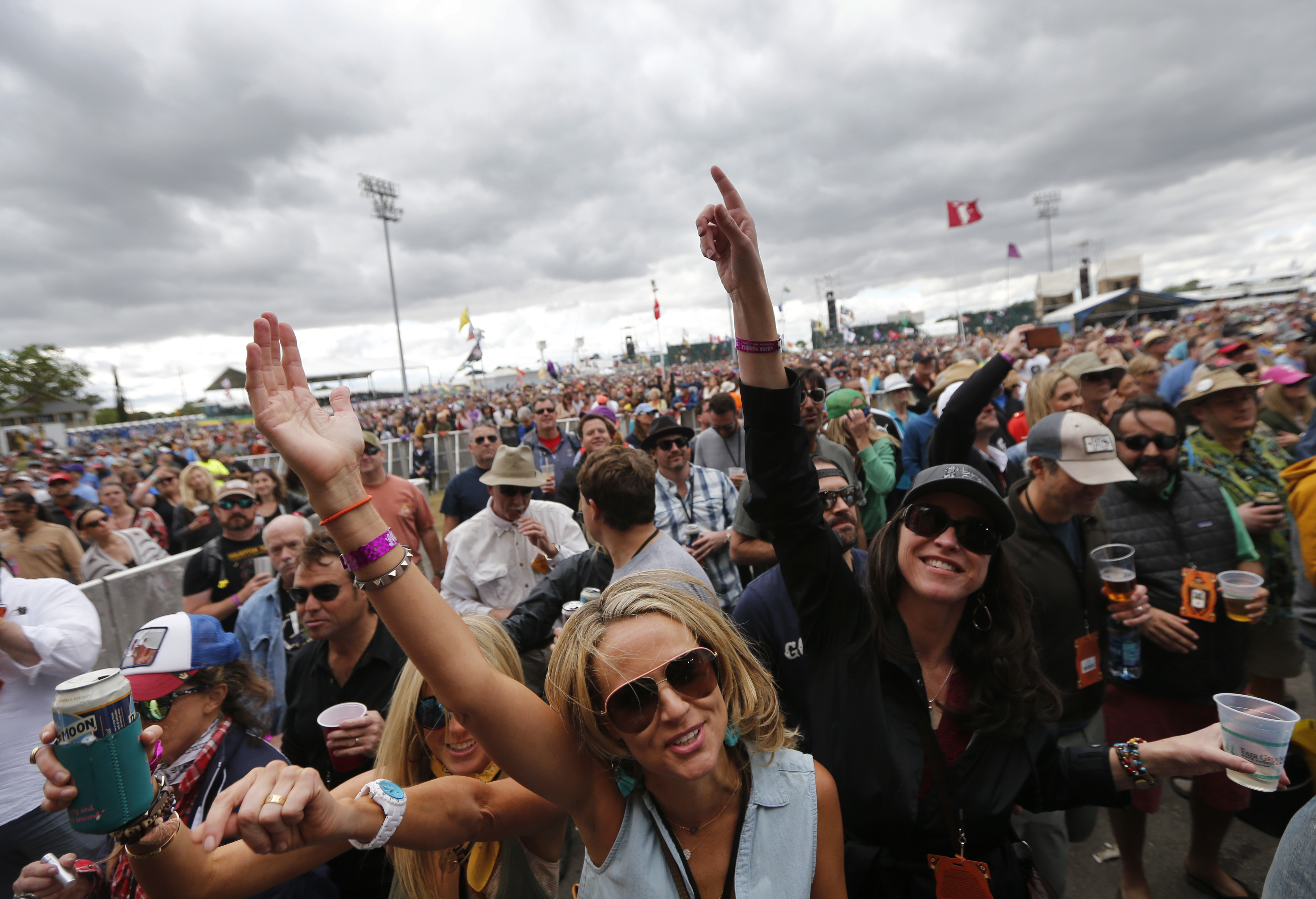 Fans cheer as Widespread Panic performs at the New Orleans Jazz and Heritage Festival in New Orleans, Thursday, May 4, 2017. (AP Photo/Gerald Herbert)
