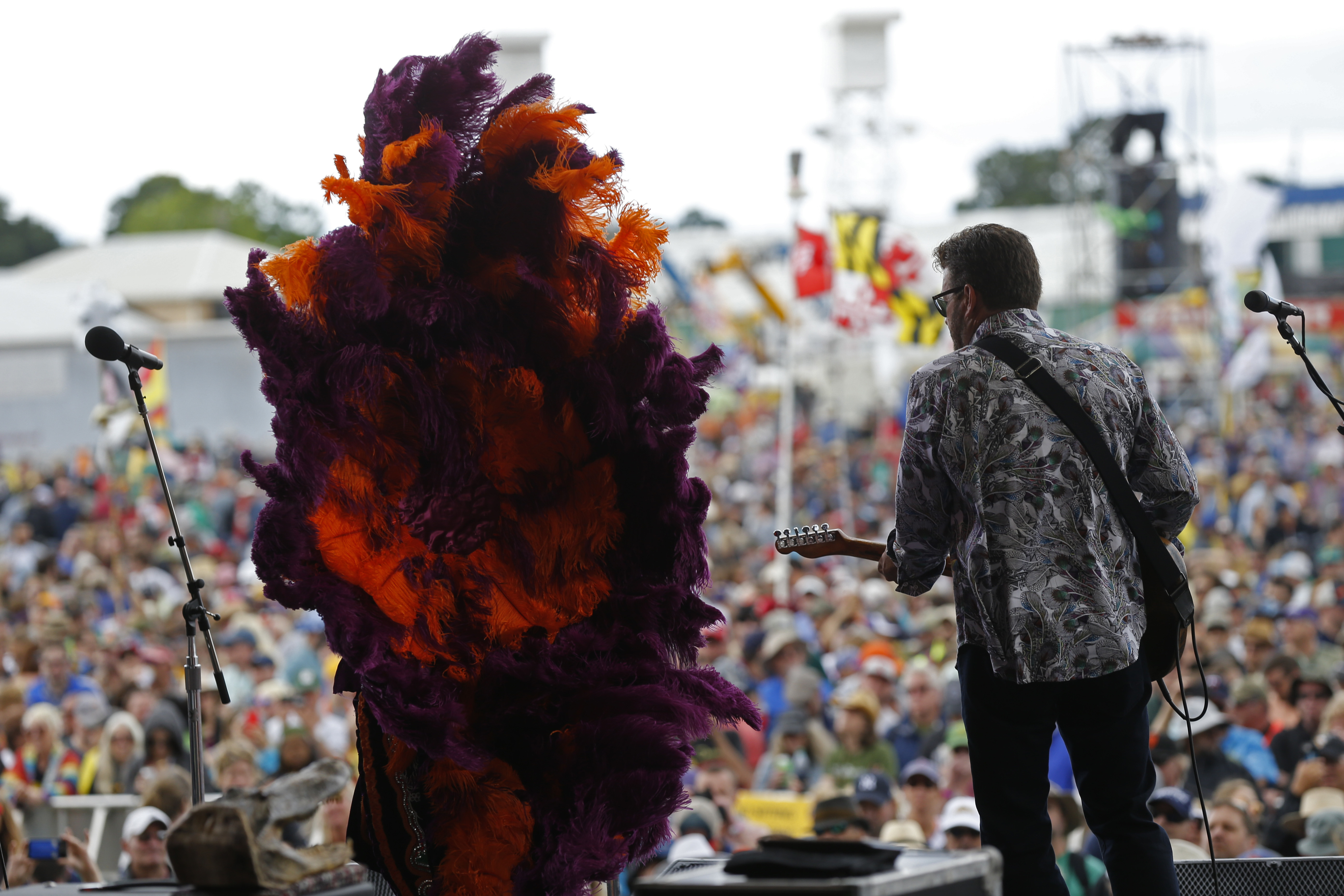 Big Chief Monk Boudreax of the Golden Eagles Mardi Gras Indian tribe, performs with the band Voice of the Wetlands All-Stars, at the New Orleans Jazz and Heritage Festival in New Orleans, Thursday, May 4, 2017. (AP Photo/Gerald Herbert)