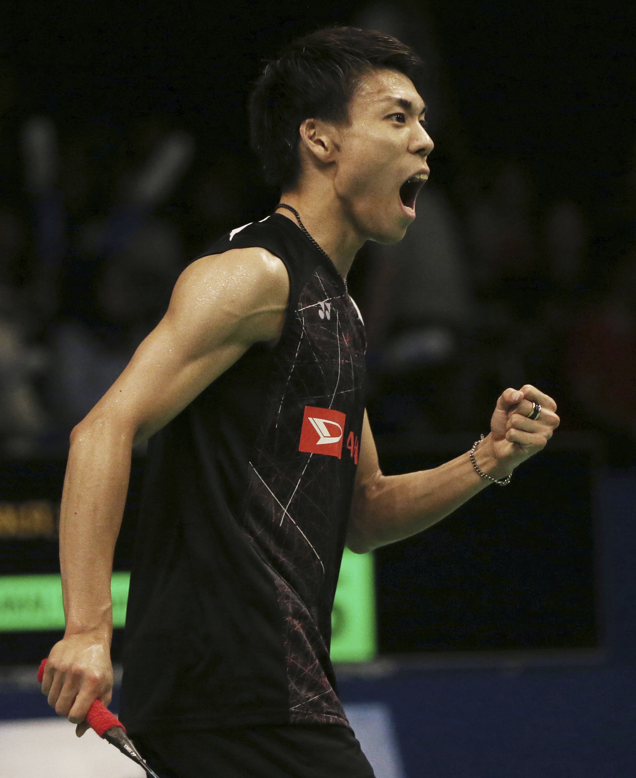 Japan's Kazumasa Sakai reacts after defeating Denmark's Emil Holst during the second round match of the Indonesia Open badminton championship in Jakarta, Indonesia, Thursday, June 15, 2017. (AP Photo/Dita Alangkara)