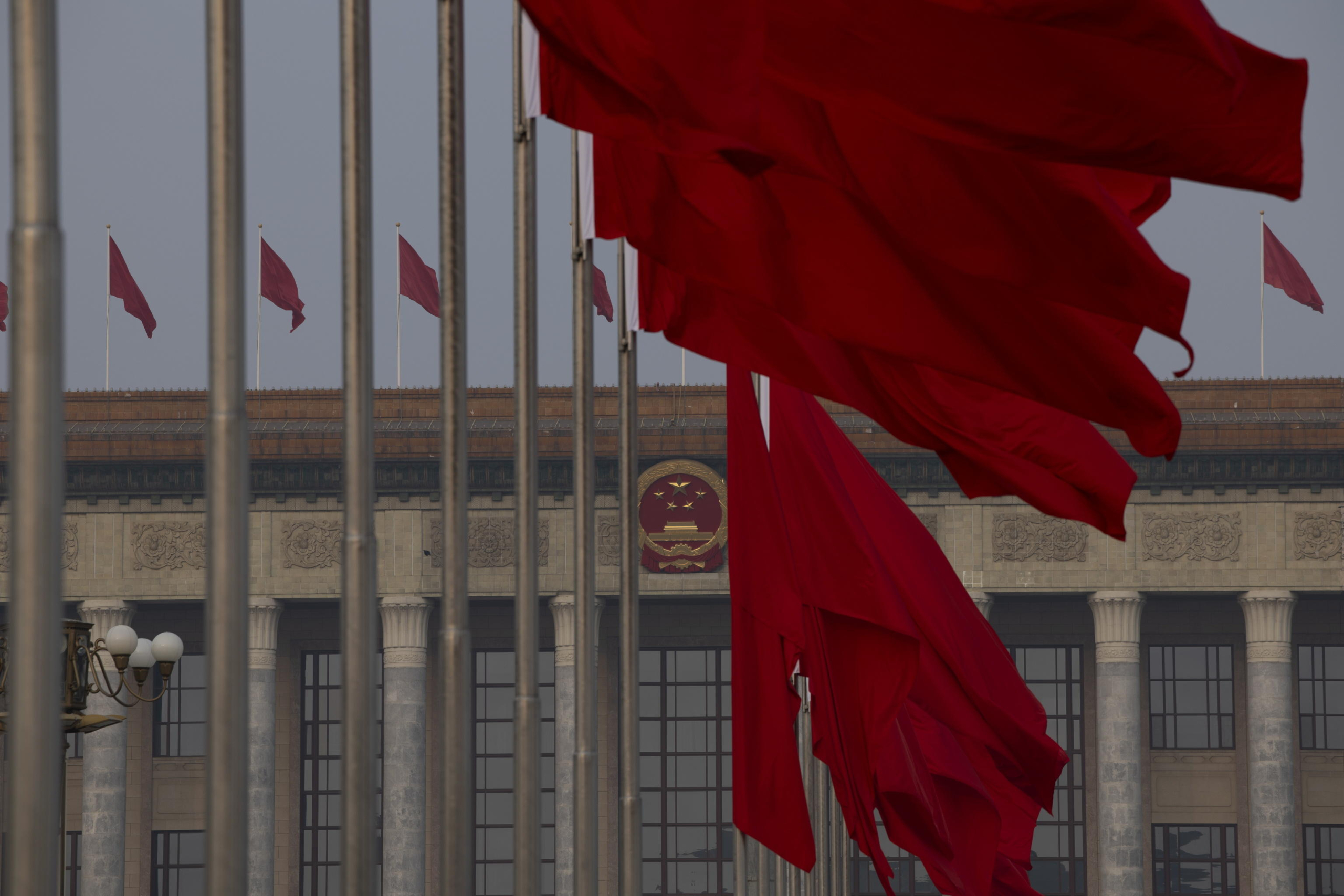 epa11953084 Red flags flap in the wind at Tiananmen Square ahead of the closing meeting of the Third Session of the 14th Chinese People's Political Consultative Conference (CPPCC) of China at the Great Hall of People in Beijing, China, 10 March 2025. China holds two major annual political meetings, the National People's Congress (NPC) and the Chinese People's Political Consultative Conference (CPPCC) which run alongside and together are known as 'Lianghui' or 'Two Sessions.'  EPA/ANDRES MARTINEZ CASARES