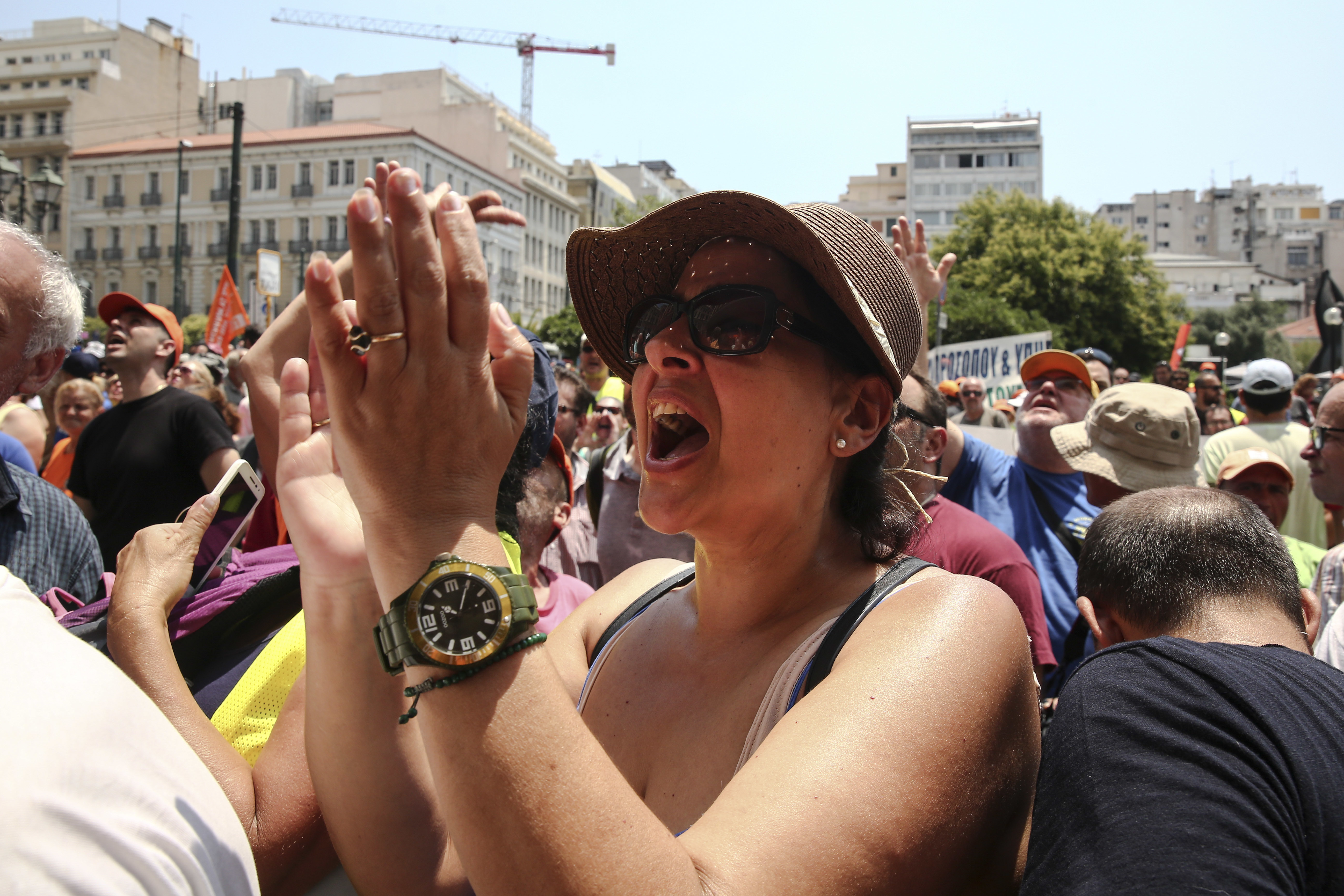 A protester chants slogans during a rally outside the Interior Ministry in Athens, on Monday, June 26, 2017. With a heat wave expected later this week, Greece's government Monday urging striking garbage collectors to return to work after a 10-day protest has left huge piles of trash around Athens. (AP Photo/Yorgos Karahalis)