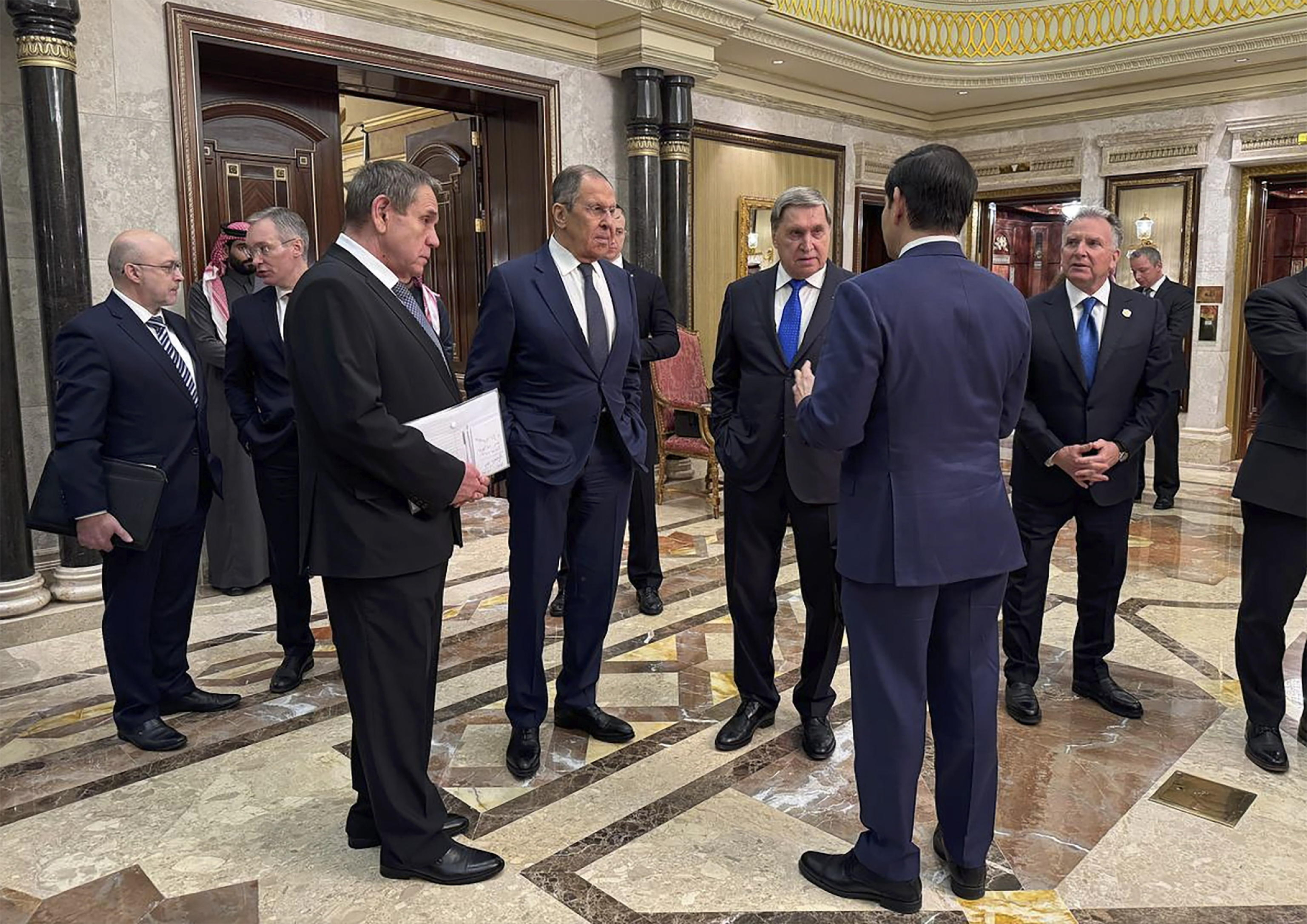 epa11904427 A handout photo made available by the Russian Foreign Ministry Press Service shows Russian Foreign Minister Sergey Lavrov (4-L) and Russian presidential aide Yury Ushakov (C) speak with U.S. Secretary of State Marco Rubio (2-R), U.S. National Security Advisor Mike Waltz (2-L), and U.S. Middle East envoy Steve Witkoff (R) after their meeting at Diriyah Palace in Riyadh, Saudi Arabia, 18 February 2025. The agenda of the meeting of the Russian presidential aide Yuri Ushakov, Russian Foreign Minister Sergey Lavrov with American officials in Riyadh on 18 February is devoted to the restoration of the entire range of bilateral relations, as well as the preparation of possible negotiations on the Ukrainian settlement, the Kremlin reported.  EPA/RUSSIAN FOREIGN MINISTRY PRESS SERVICE HANDOUT HANDOUT EDITORIAL USE ONLY/NO SALESHANDOUT EDITORIAL USE ONLY/NO SALES