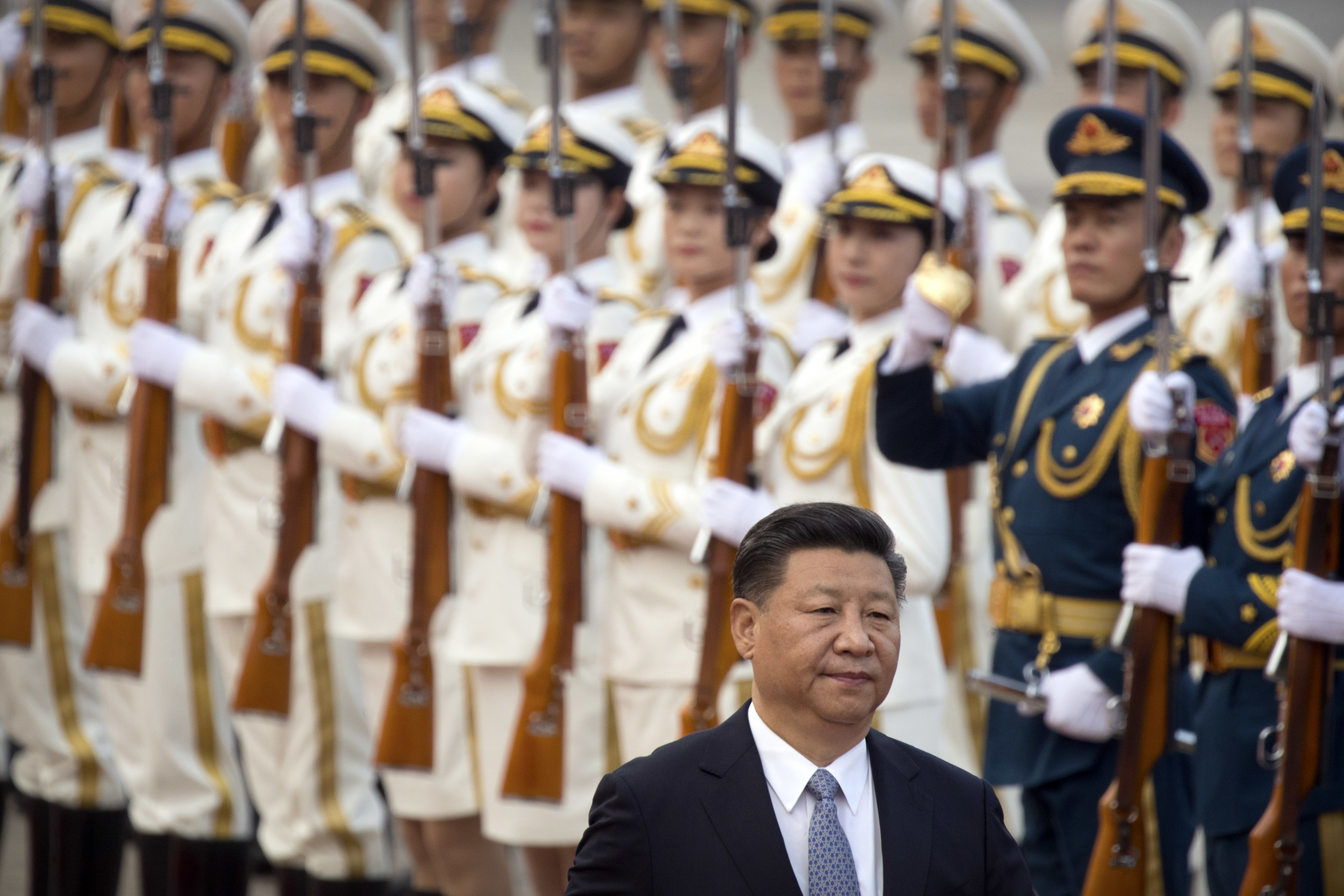 Chinese President Xi Jinping reviews an honor guard during a welcome ceremony at the Great Hall of the People in Beijing, Tuesday, July 18, 2017. (AP Photo/Mark Schiefelbein)