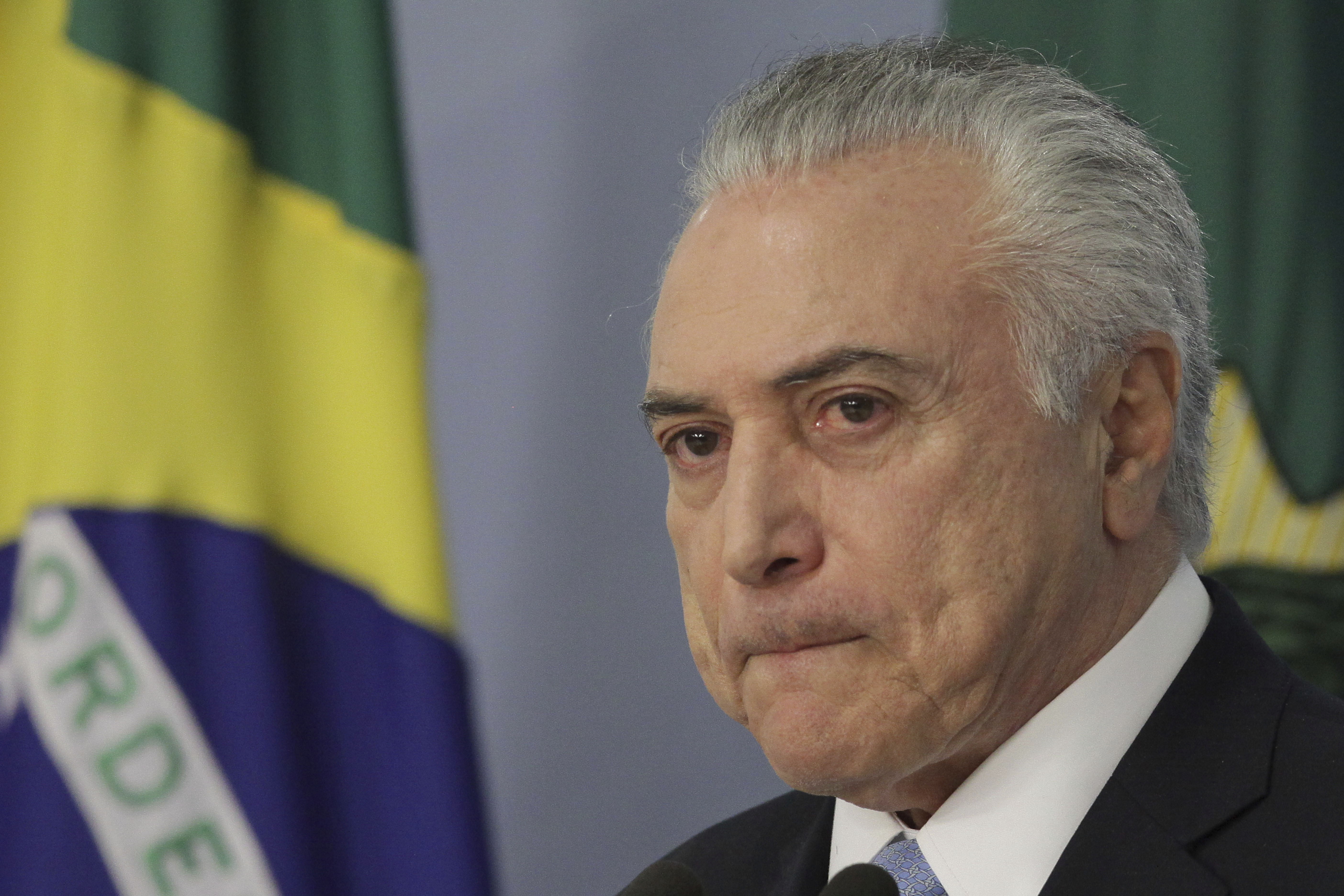 Brazil's President Michel Temer gives a statement at Planalto presidential palace in Brasilia, Brazil, Wednesday, Aug. 2, 2017, after surviving a key congressional vote that could have suspended him over a bribery charge. The bribery allegation, which stunned even Brazilians inured to graft cases, was the latest in a bevy of scandals that has rocked the administration and created deep uncertainty and angst in Latin America’s largest nation. (AP Photo/Eraldo Peres)
