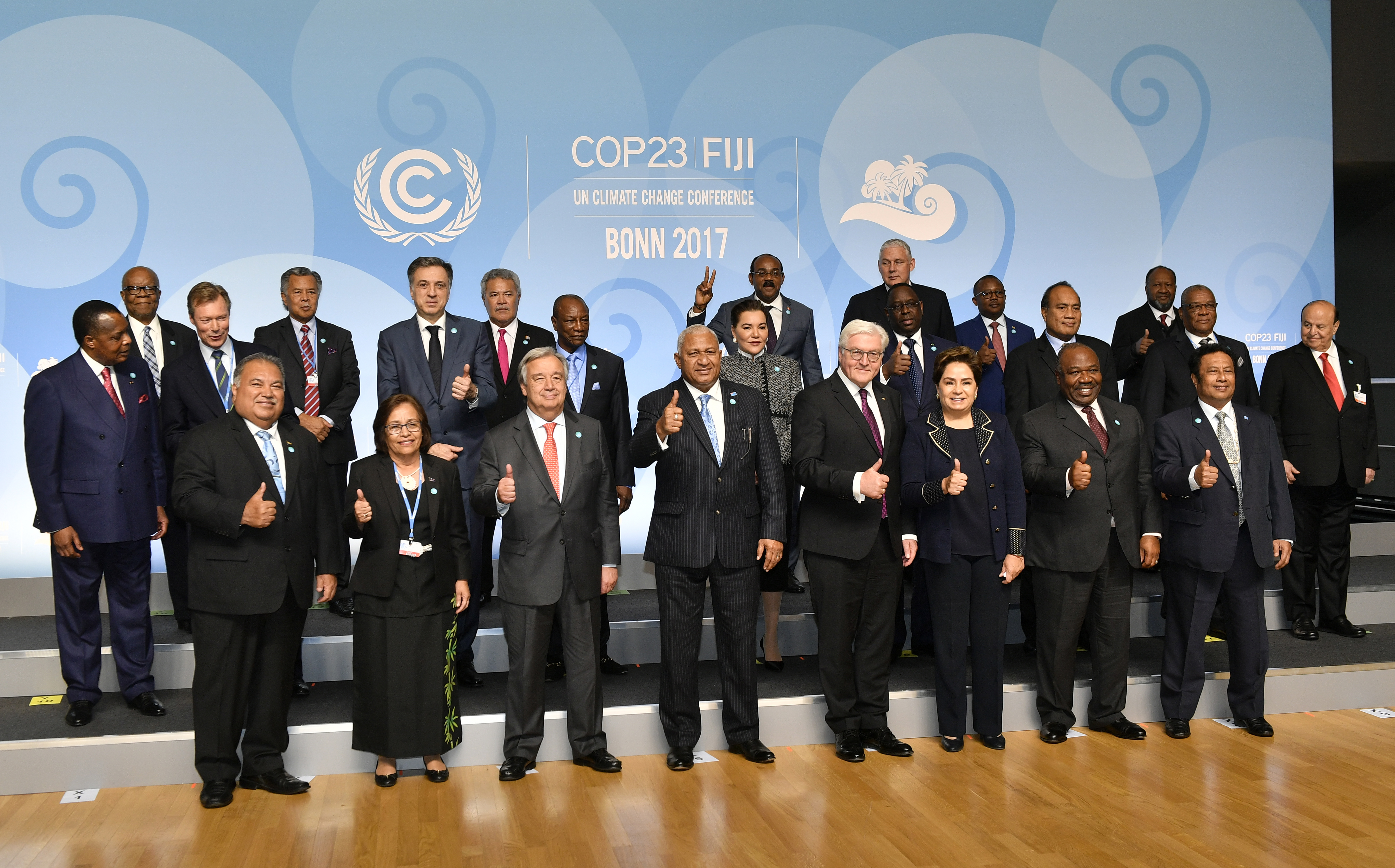 Fiji prime minister and COP president Frank Bainimarama, center, is flanked by UN Secretary General Antonio Guterres, left of him, and German President Frank-Walter Steinmeier and Patricia Espinosa, executive secretary of the United Nations Framework Convention on Climate Change as they and other participants pose for a group photo during the 23rd Conference of the Parties (COP) climate talks in Bonn, Germany, Wednesday, Nov. 15, 2017. World leaders arrive at the global climate talks in Germany on Wednesday to give the negotiations a boost going into the final stretch. (AP Photo/Martin Meissner)
