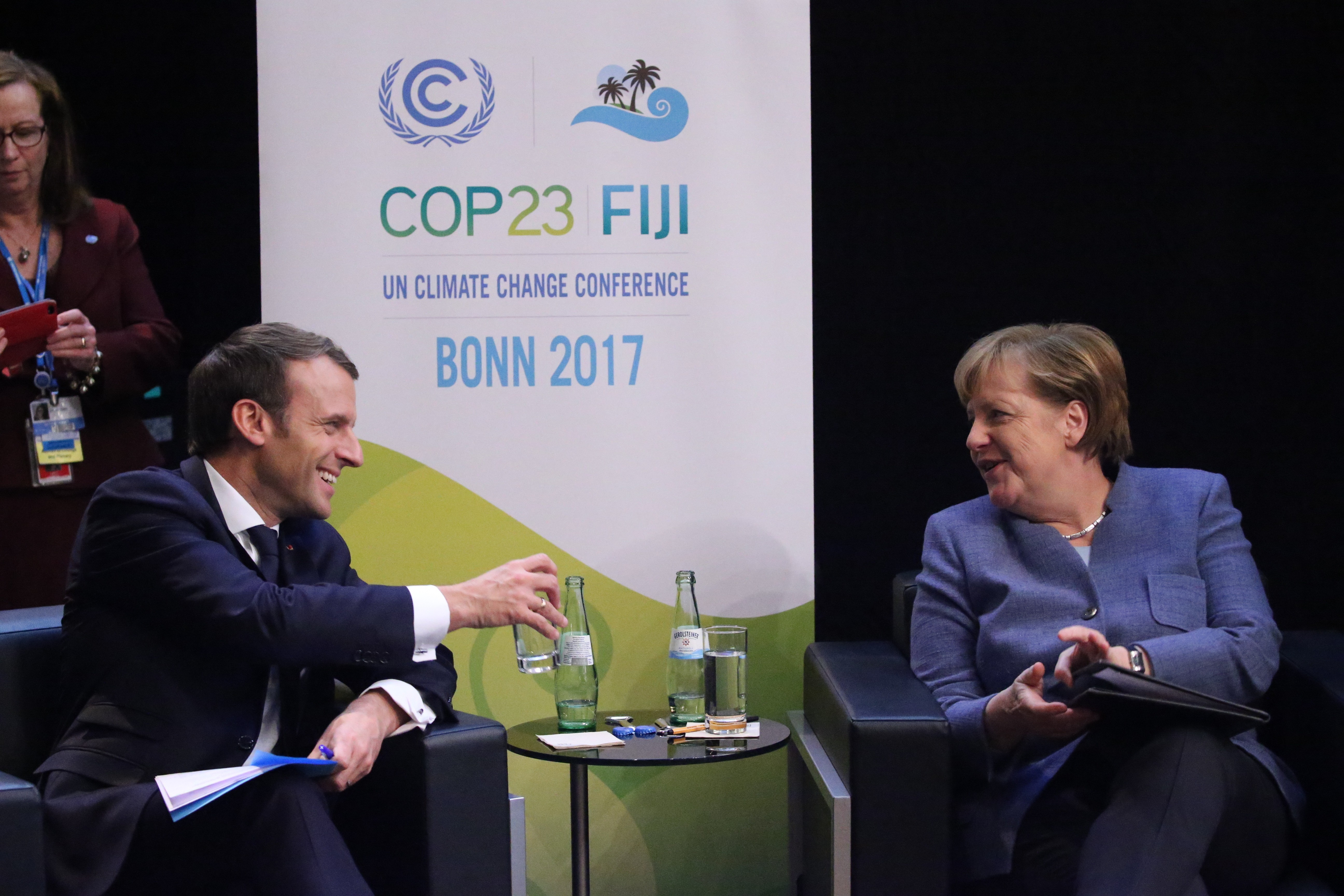 German Chancellor Angela Merkel (CDU, R) and the President of France, Emmanuel Macron, speak with each other during the World Climate Conference in Bonn, Germany, 15 November 2017. The COP23 World Climate Conference takes place in Bonn between 06 and 17 November. Photo by: Oliver Berg/picture-alliance/dpa/AP Images