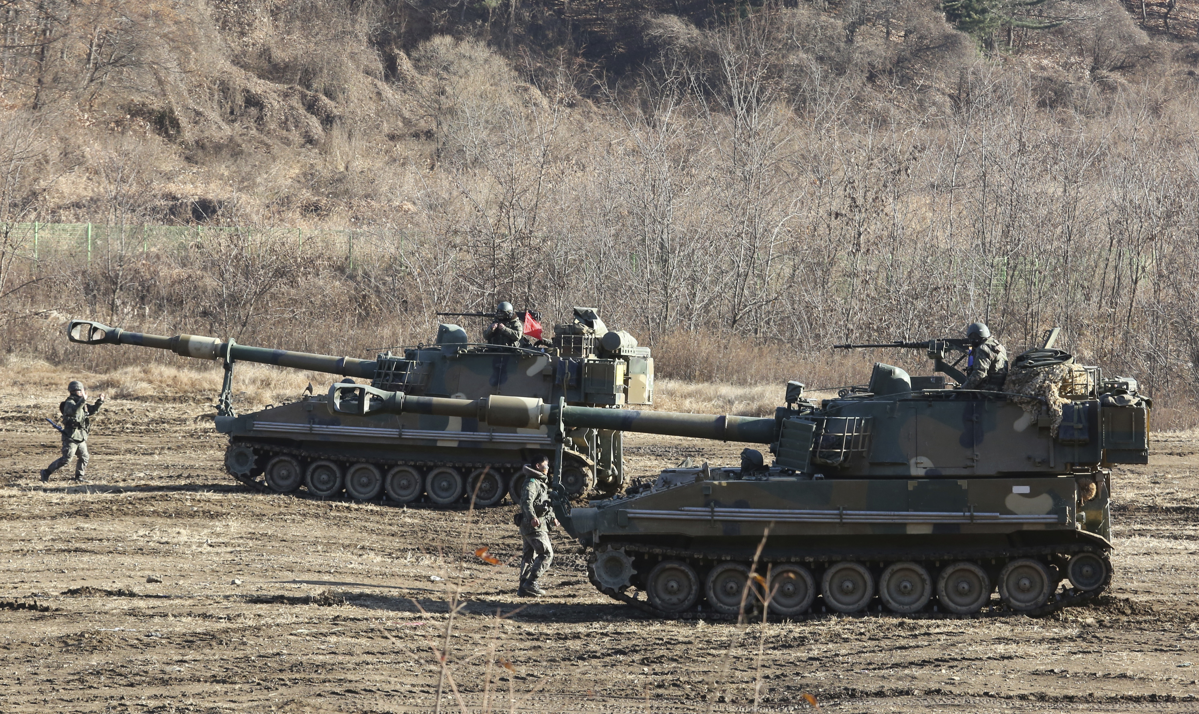 South Korean army's K-55 self-propelled howitzers move during a military exercises in Paju, South Korea, near the border with North Korea, Wednesday, Nov. 29, 2017. After 2 ½ months of relative peace, North Korea launched its most powerful weapon yet early Wednesday, a presumed intercontinental ballistic missile that could put Washington and the entire eastern U.S. seaboard within range. (AP Photo/Ahn Young-joon)