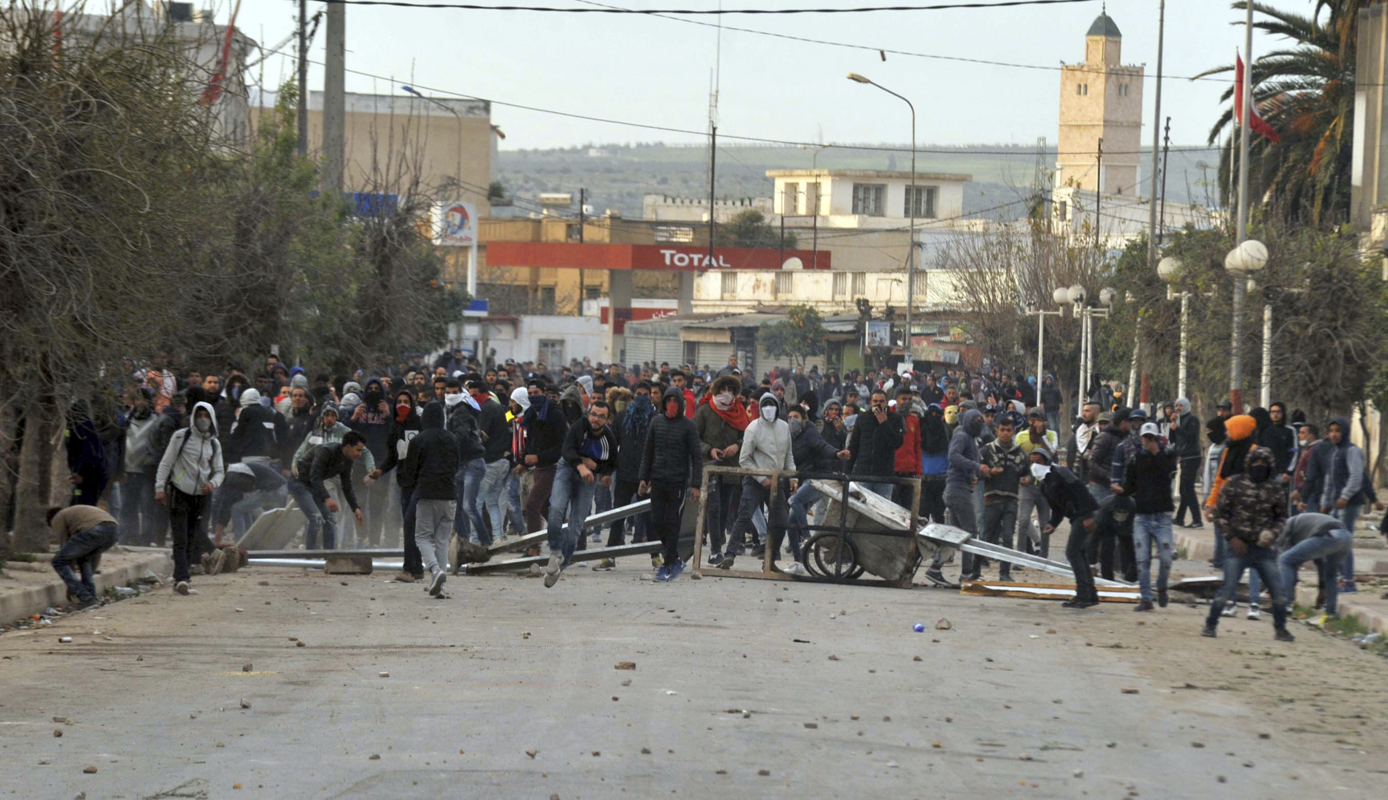 Protesters take the streets during anti-government protests, in Tebourba, south of the Tunisian capital, Tunis, Tuesday, Jan. 9, 2018. Tunisia's prime minister promised Tuesday to crack down on rioters after violent protests over price hikes left one person dead and raised fears of broader unrest in the country that was the birthplace of the Arab Spring.(AP Photo/Anis Ben Ali)