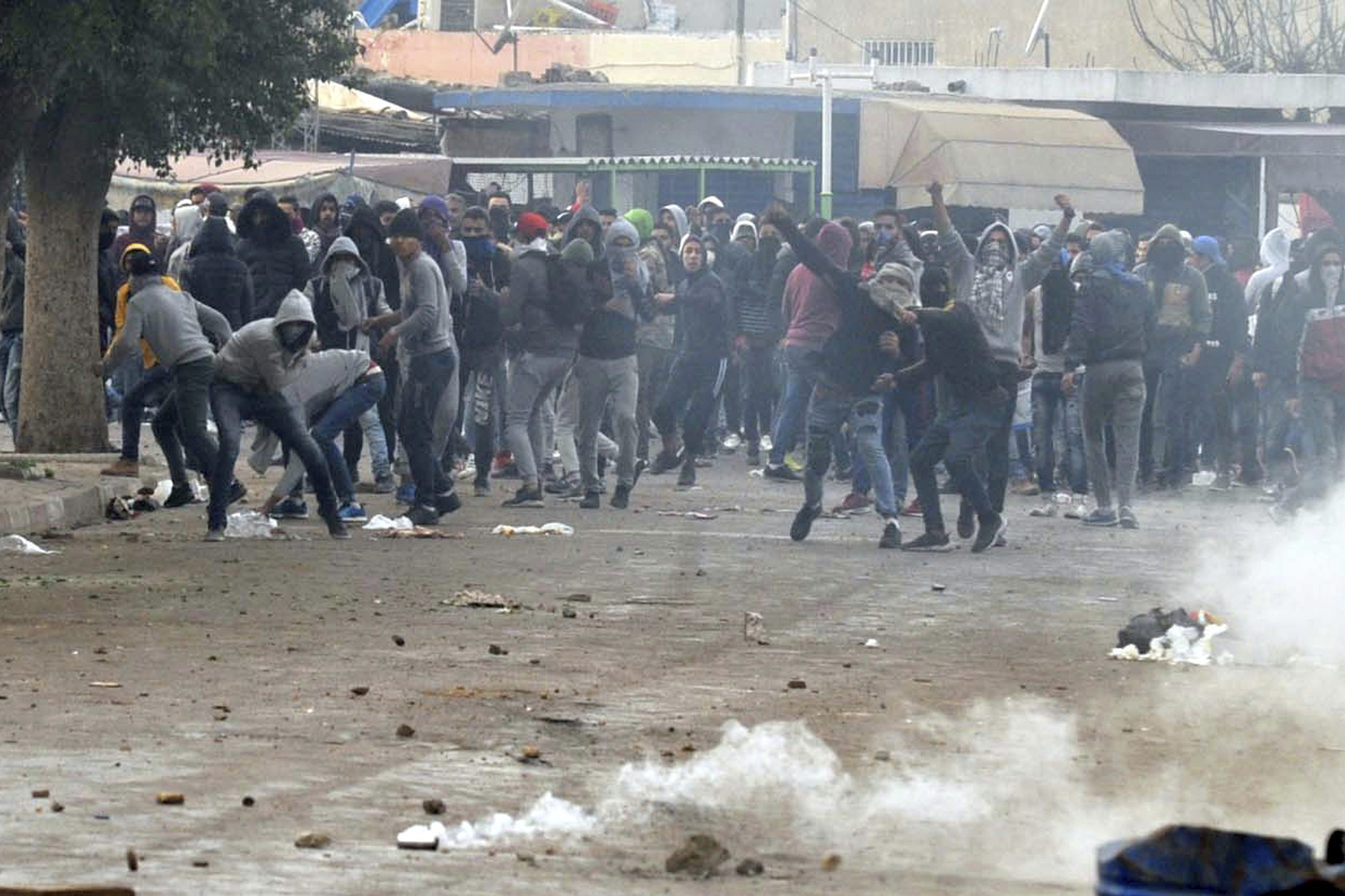 Demonstrators take the streets during anti-government protests, in Tebourba, south of the Tunisian capital, Tunis, Tuesday, Jan. 9, 2018. Tunisia's prime minister promised Tuesday to crack down on rioters after violent protests over price hikes left one person dead and raised fears of broader unrest in the country that was the birthplace of the Arab Spring. (AP Photo/Anis Ben Ali)
