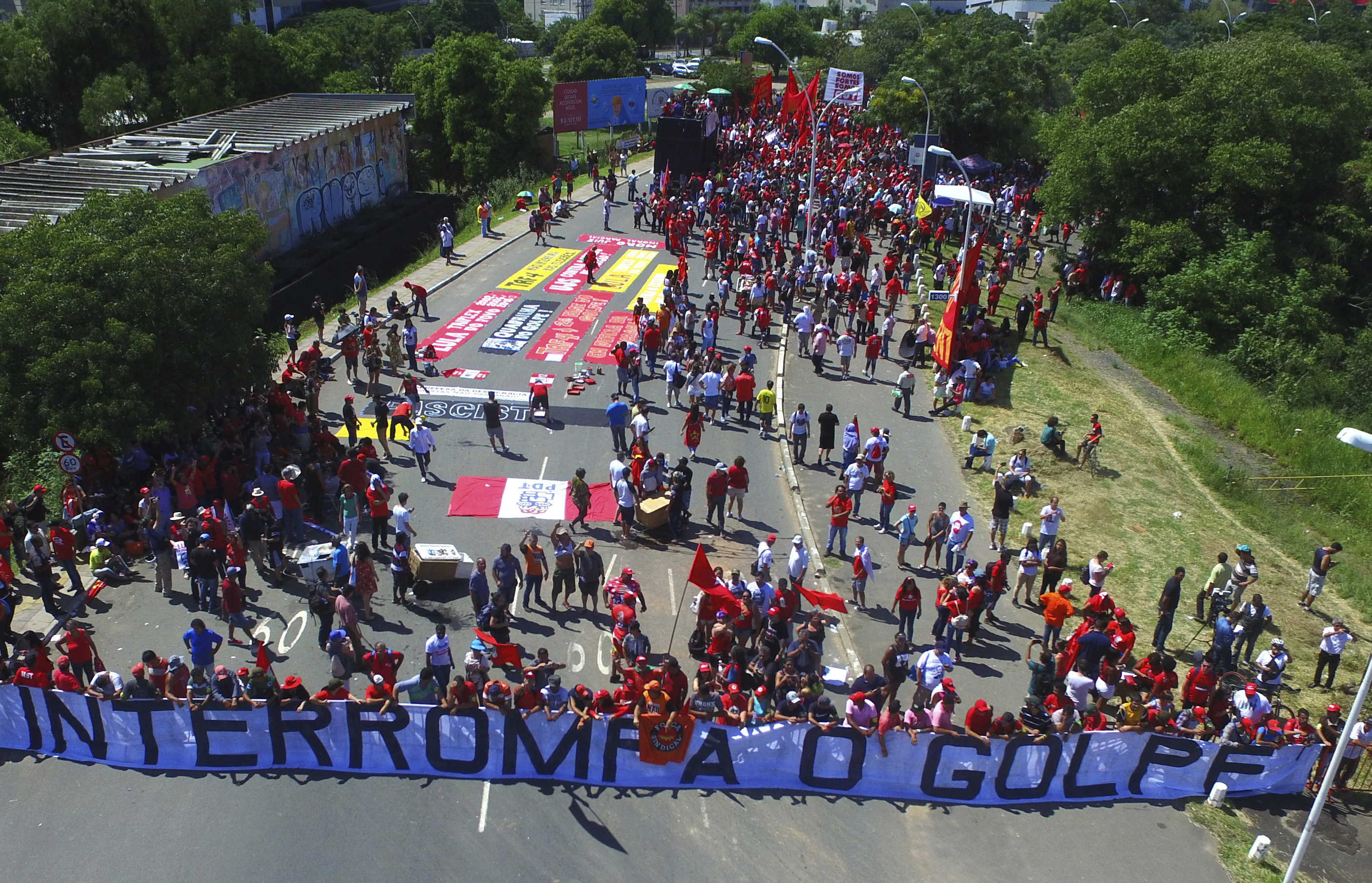 Supporters of ex-President Luiz Inacio Lula da Silva hold a banner that reads in Portuguese: 