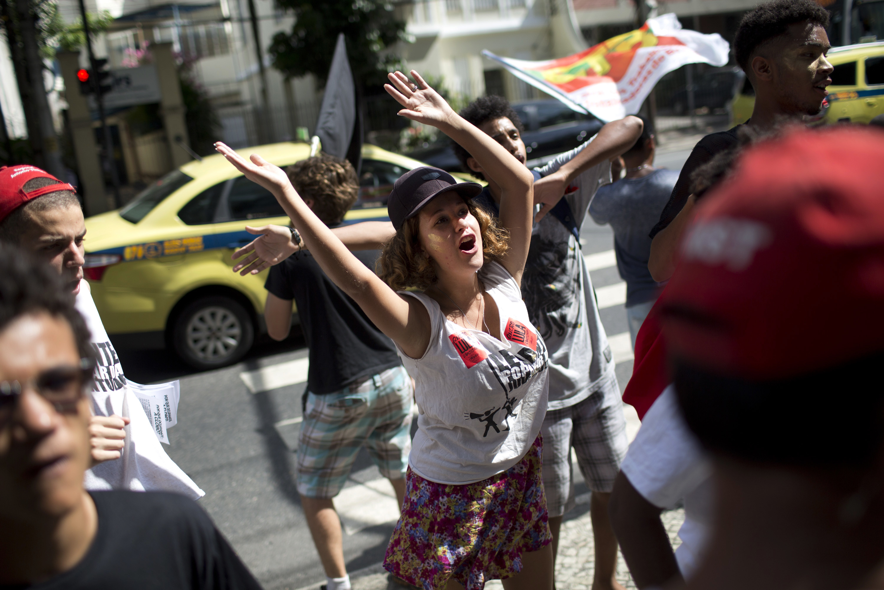 People gather in support of former Brazilian President Luiz Inacio Lula da Silva in Rio de Janeiro, Brazil, Wednesday, Jan. 24, 2018. An appellate court in Brazil on Wednesday considered whether to uphold or throw out a corruption conviction against da Silva, a decision that could impact presidential elections and even stability in Latin America's largest nation. (AP Photo/Silvia Izquierdo)