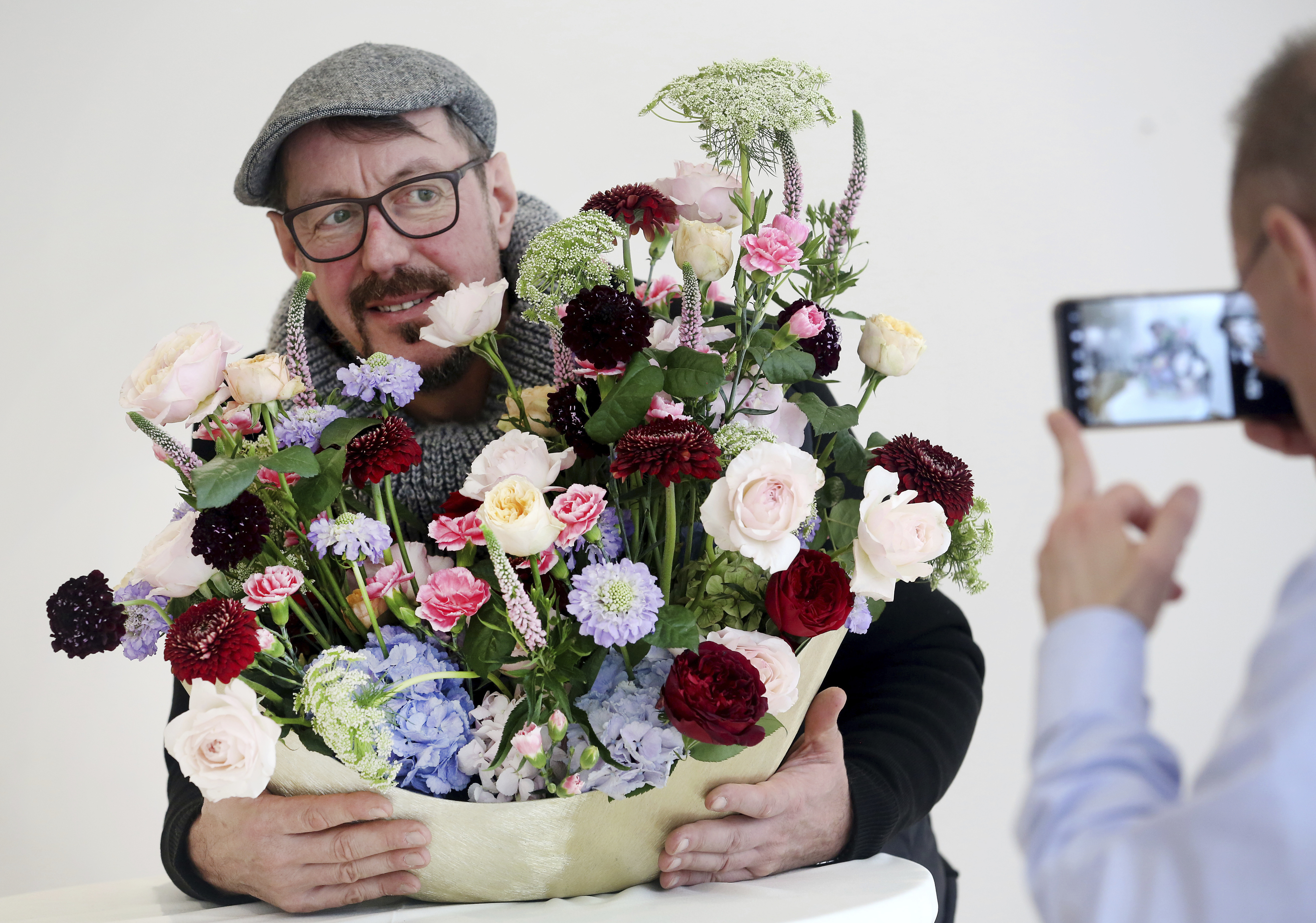 Botanic designer Manfred Hoffmann presents the flower bouquet trend 'Romance 3.0' at the preview of the International Plant Fair (IPM) in Essen, Germany, 22 January 2018. The world-famous gardening fair showcases the innovations of around 1600 enthusiasts and professionals hailing from 50 different countries. Photo by: Roland Weihrauch/picture-alliance/dpa/AP Images