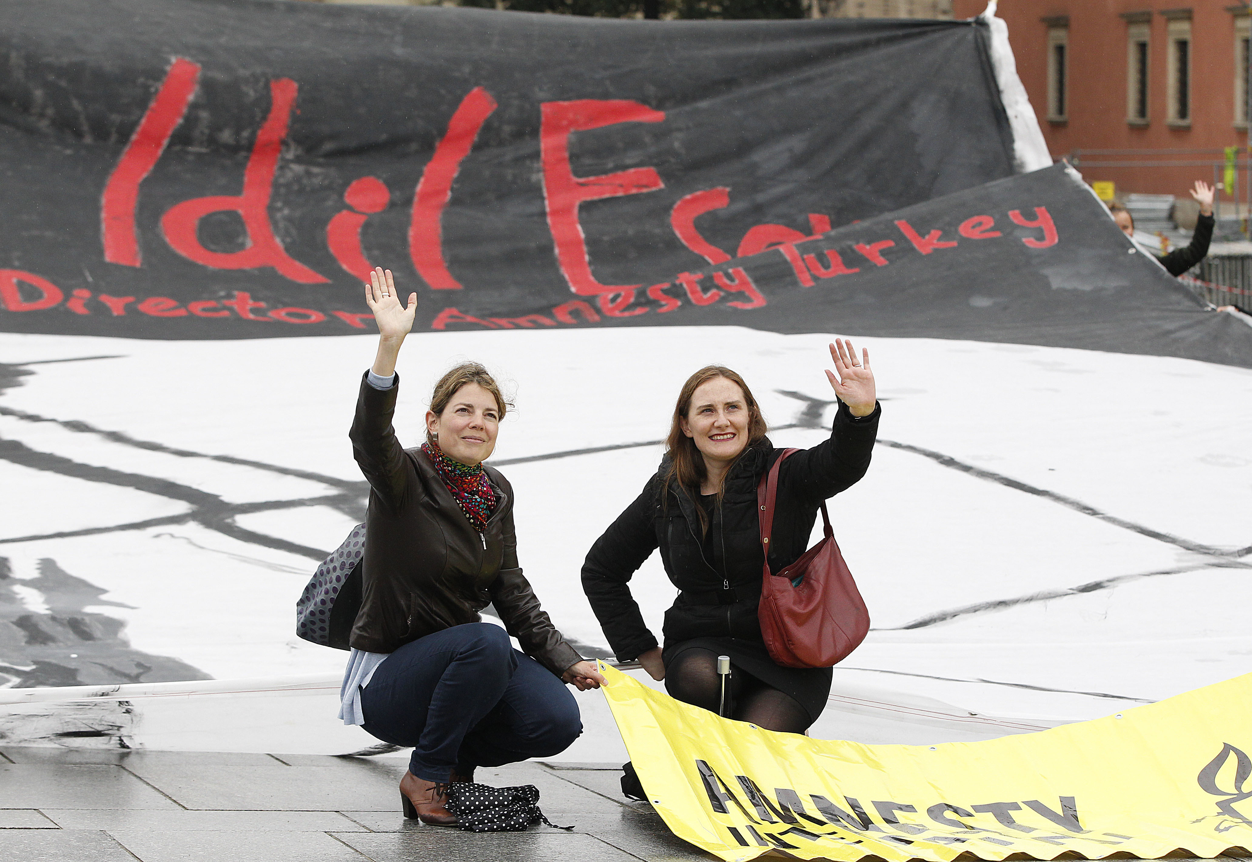 Members of Amnesty International in Poland stage a demonstration demanding the release of Idil Eser, the jailed Turkey director of the human rights organization, in Warsaw, Poland, Wednesday Sept. 20, 2017. The arrest of Eser and several other human rights activists and journalists have added to widespread concerns about the erosion of rights and freedoms in Turkey. (AP Photo/Czarek Sokolowski)