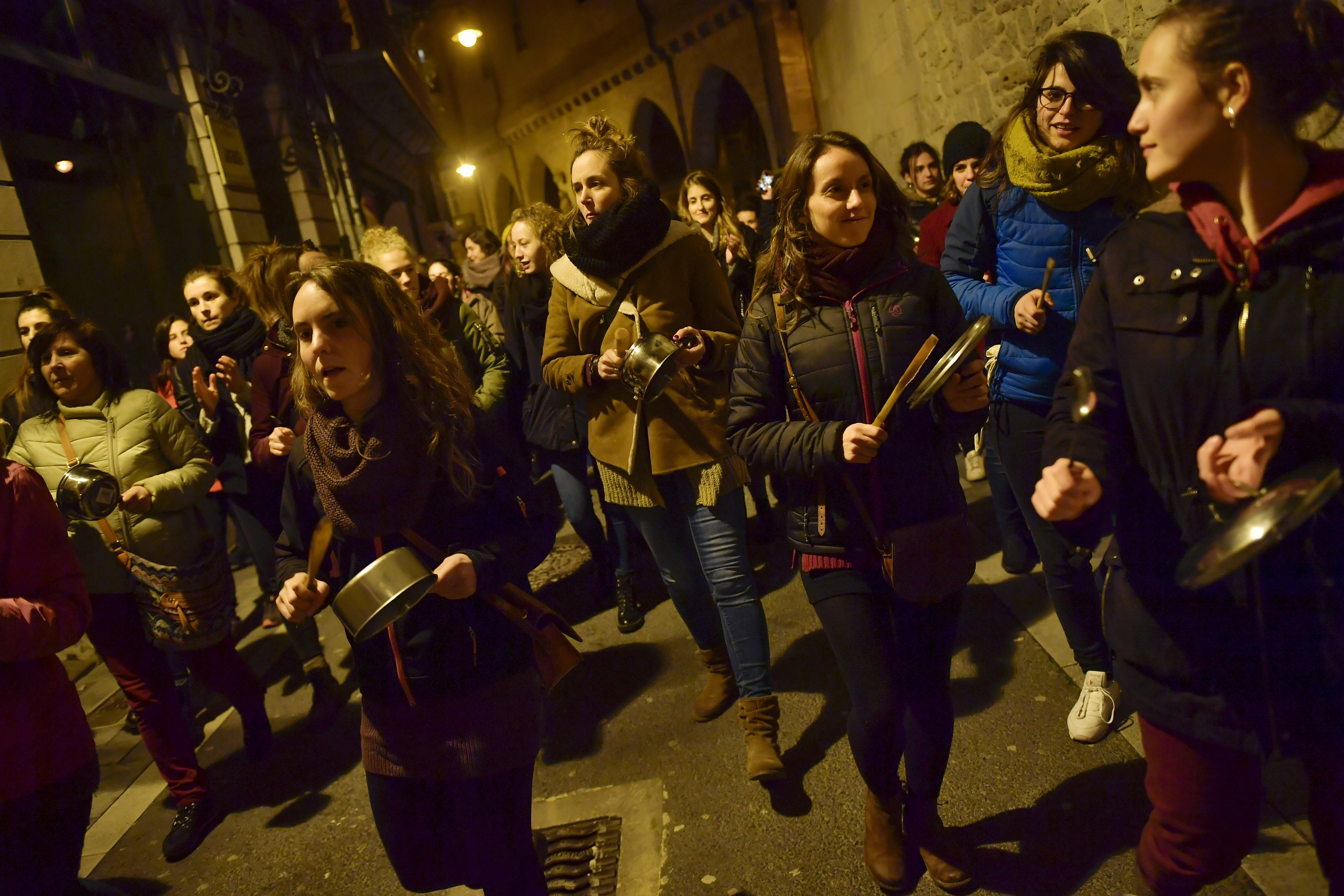 Demonstrators protest male violence against women and demand an equality labour opportunities during the general female strike to commemorate International Women's Day, in Pamplona, northern Spain, Thursday, March 8, 2018. (AP Photo/Alvaro Barrientos)