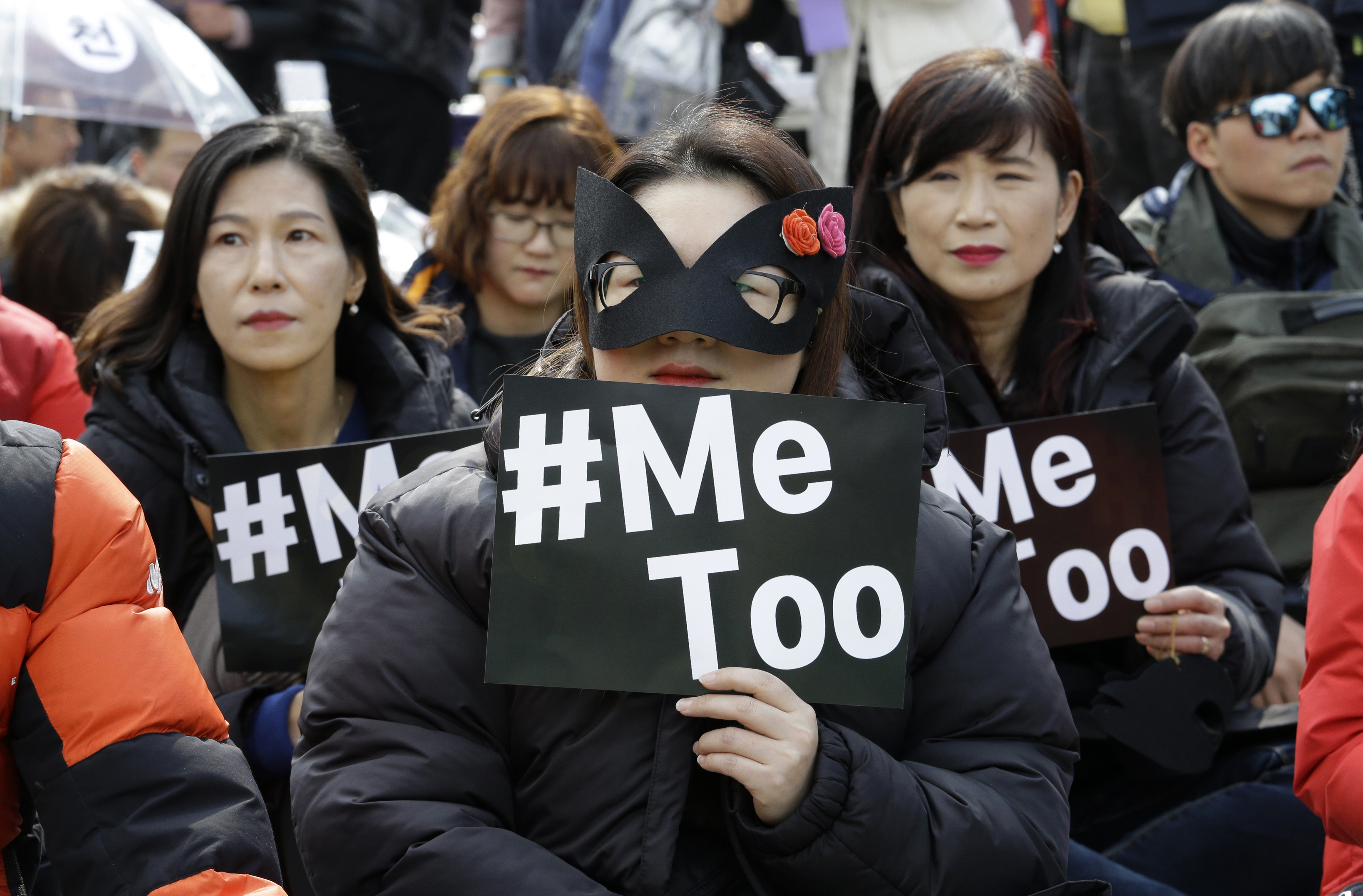 Female workers supporting the MeToo movement wearing black attend a rally to mark the International Women's Day in Seoul, South Korea, Thursday, March 8, 2018. (AP Photo/Ahn Young-joon)