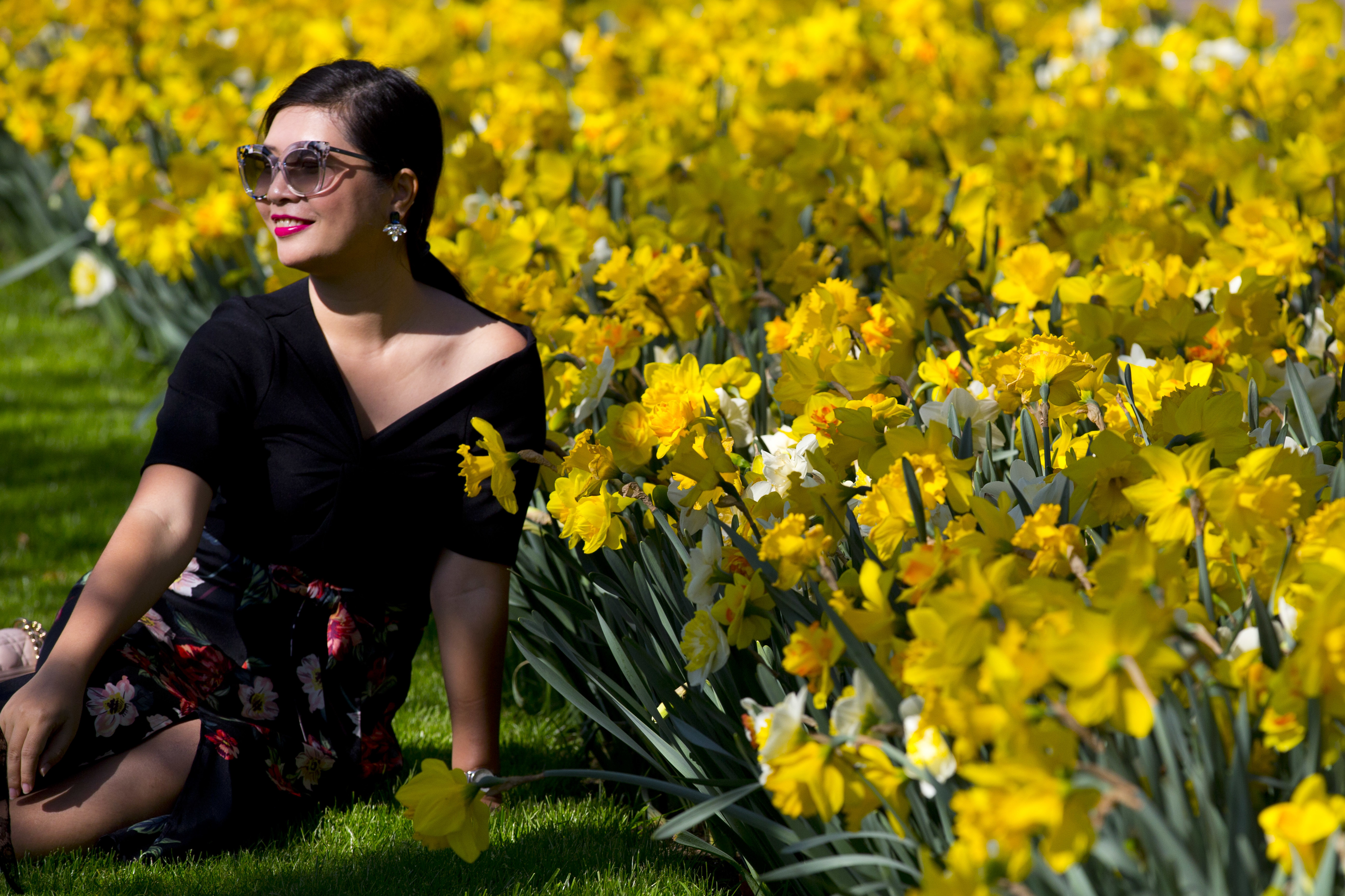 A tourists poses for a picture when visiting the Keukenhof spring garden in Lisse, west central Netherlands, Friday, April 20, 2018. De Keukenhof, open till May 13th, is a 32-hectares (80 acres) floral exhibition ground filled with seven million tulips, daffodils and hyacinths which attracts around 1 million tourists from all over the world. (AP Photo/Peter Dejong)