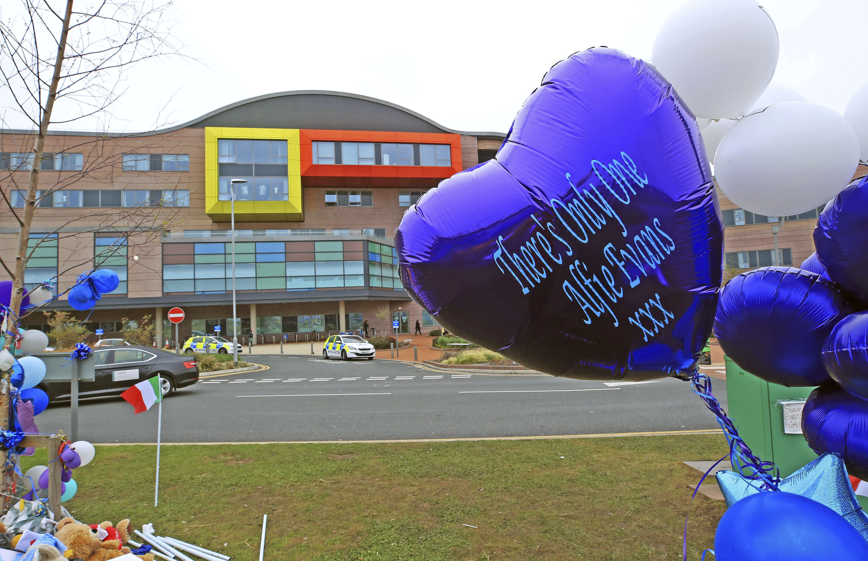 Balloons are placed outside Alder Hey Children's Hospital in Liverpool, England, where seriously ill Alfie Evans is a patient, Friday April 27, 2018.  Kate James and Tom Evans, the parents, said on Facebook that 23-month-old Alfie Evans, who had an incurable degenerative brain condition and was at the center of a legal battle over his treatment, died early morning Saturday April 28, 2018. (Peter Byrne/PA via AP)