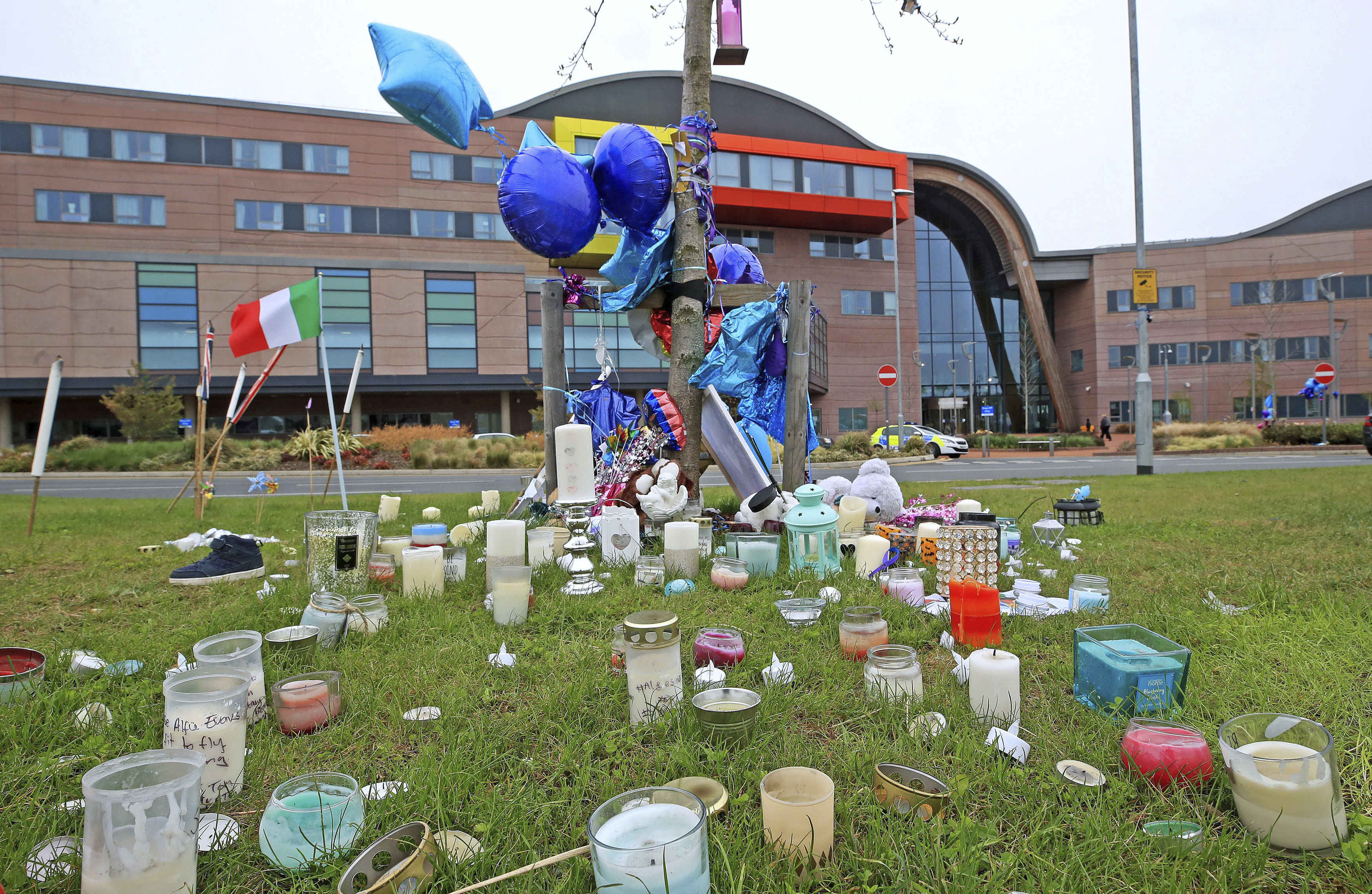 Candles and balloons are placed outside Alder Hey Children's Hospital in Liverpool, England, where seriously ill Alfie Evans is a patient, Friday April 27, 2018.  The father of terminally ill toddler Alfie Evans said Thursday that he would work with doctors to give his son 