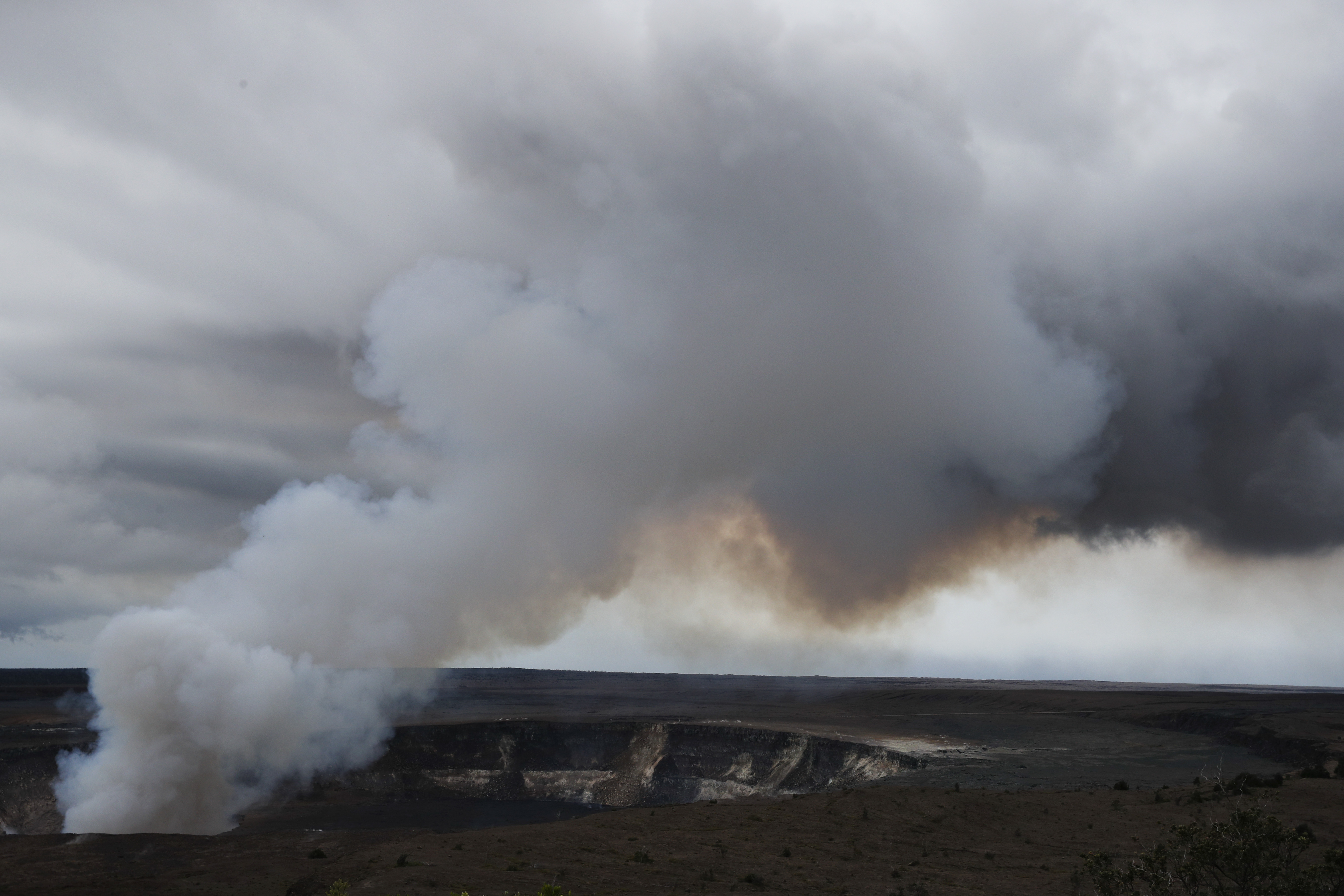 Steam and gas rise from Kilauea's summit crater in Volcanoes National Park, Hawaii, Wednesday, May 9, 2018. Geologists warned Wednesday that Hawaii's Kilauea volcano could erupt explosively and send boulders, rocks and ash into the air around its summit in the coming weeks. (AP Photo/Jae C. Hong)