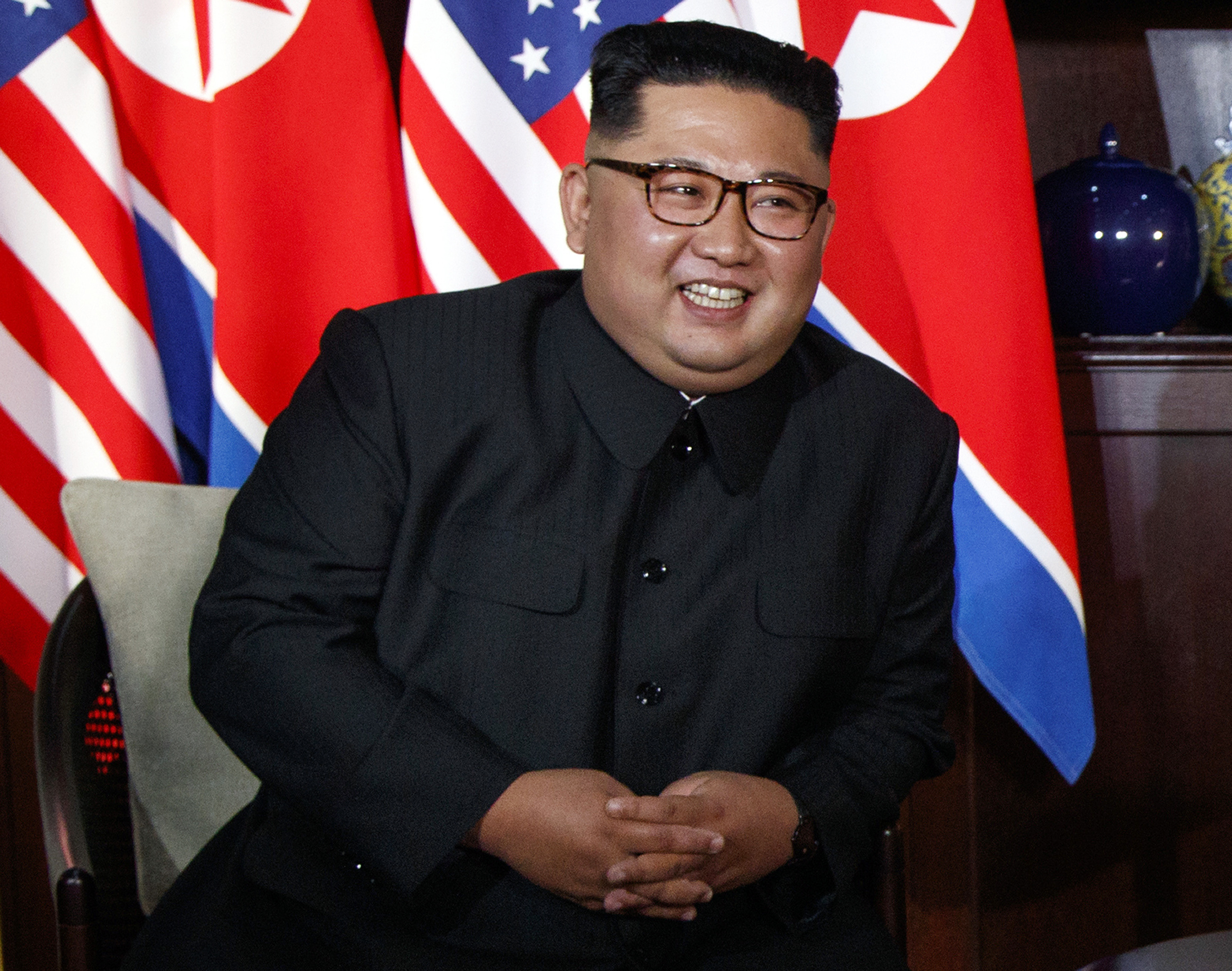 North Korean leader Kim Jong Un smiles as he meets with President Donald Trump on Sentosa Island, Tuesday, June 12, 2018, in Singapore. (AP Photo/Evan Vucci)