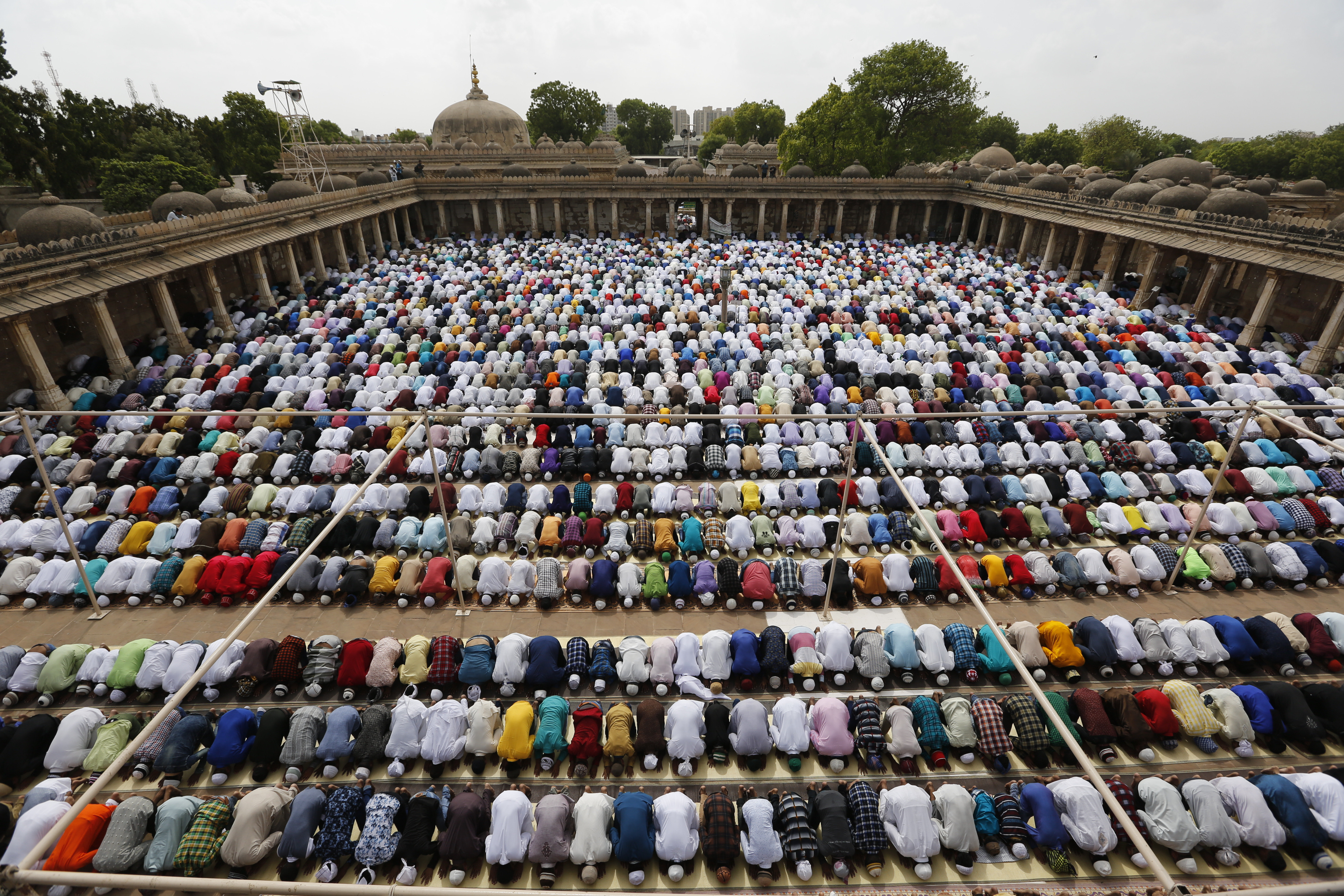 Indian Muslims offer Eid al-Fitr prayers at the Sarkhej Roza in Ahmadabad, India, Saturday, June 16, 2018. Eid al-Fitr marks the end of the fasting month of Ramadan. (AP Photo/Ajit Solanki)
