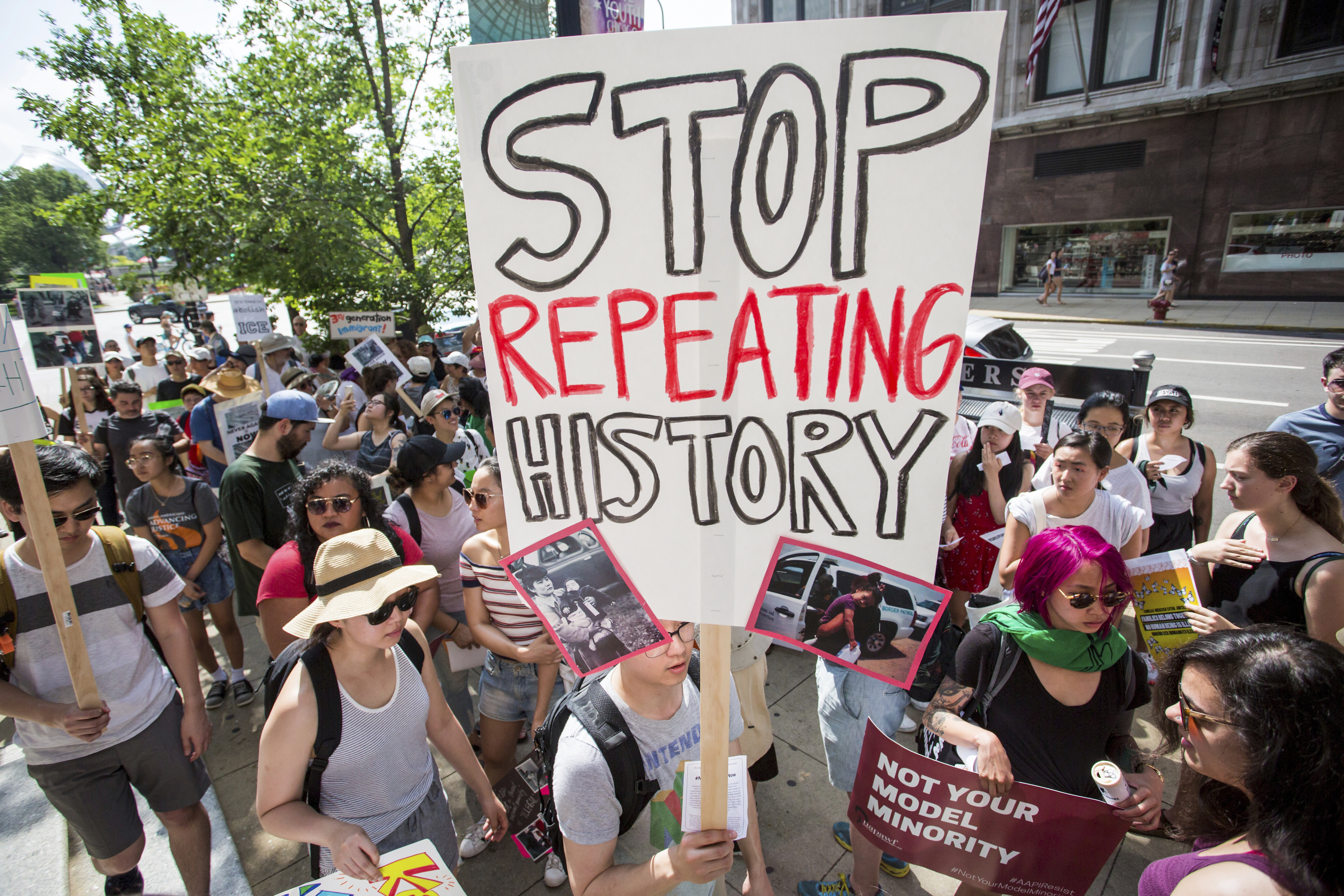 A consortium of Asian-American groups brought together by the Japanese-American Service Community participate in the Families Belong Together march in Chicago on Saturday, June 30, 2018. In major cities and tiny towns, marchers gathered across America, moved by accounts of children separated from their parents at the U.S.-Mexico border, in the latest act of mass resistance against President Donald Trump's immigration policies. (James Foster/Chicago Sun-Times via AP)