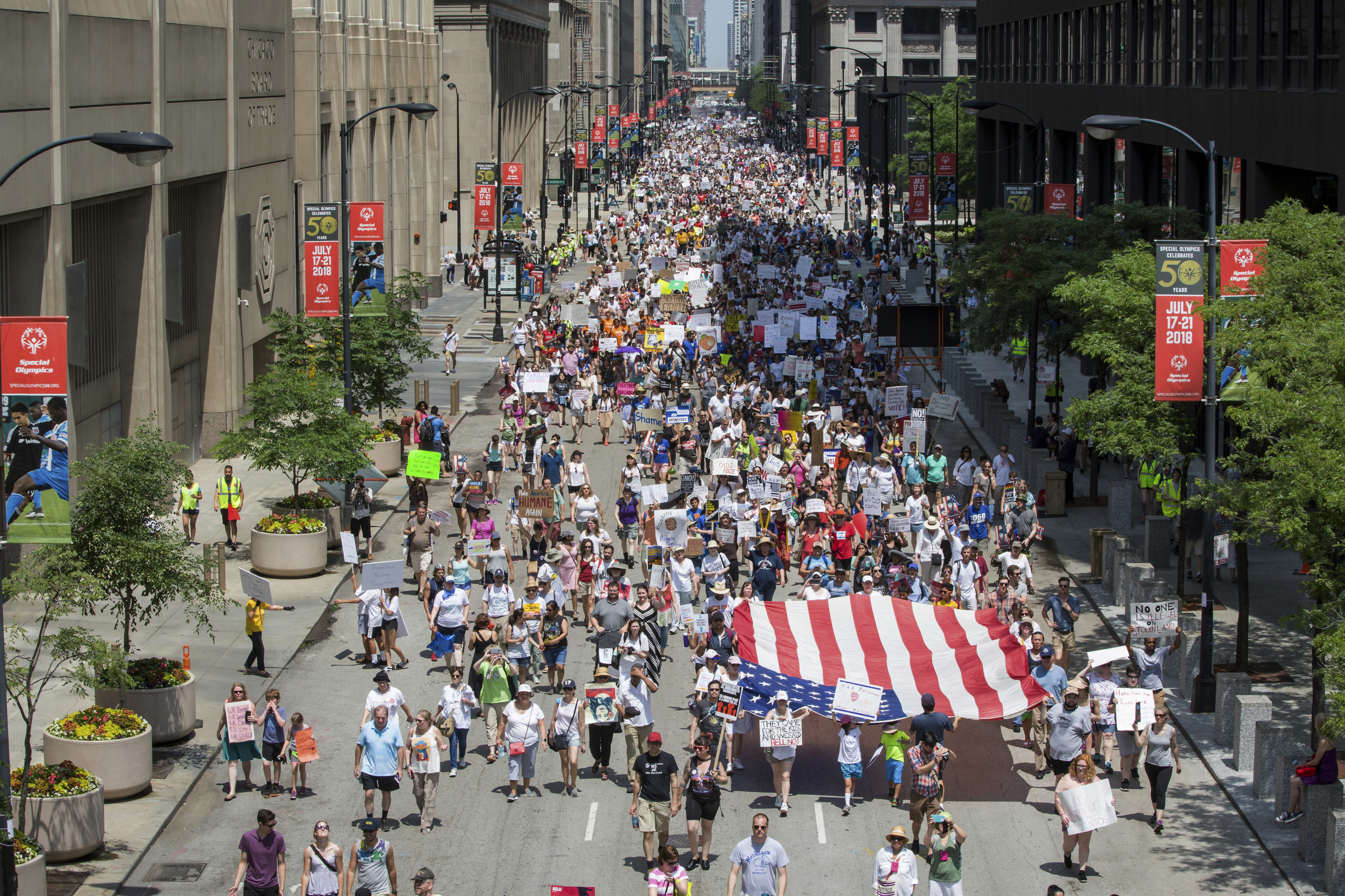 People participate in the Families Belong Together march in Chicago on Saturday, June 30, 2018. In major cities and tiny towns, marchers gathered across America, moved by accounts of children separated from their parents at the U.S.-Mexico border, in the latest act of mass resistance against President Donald Trump's immigration policies. (James Foster/Chicago Sun-Times via AP)