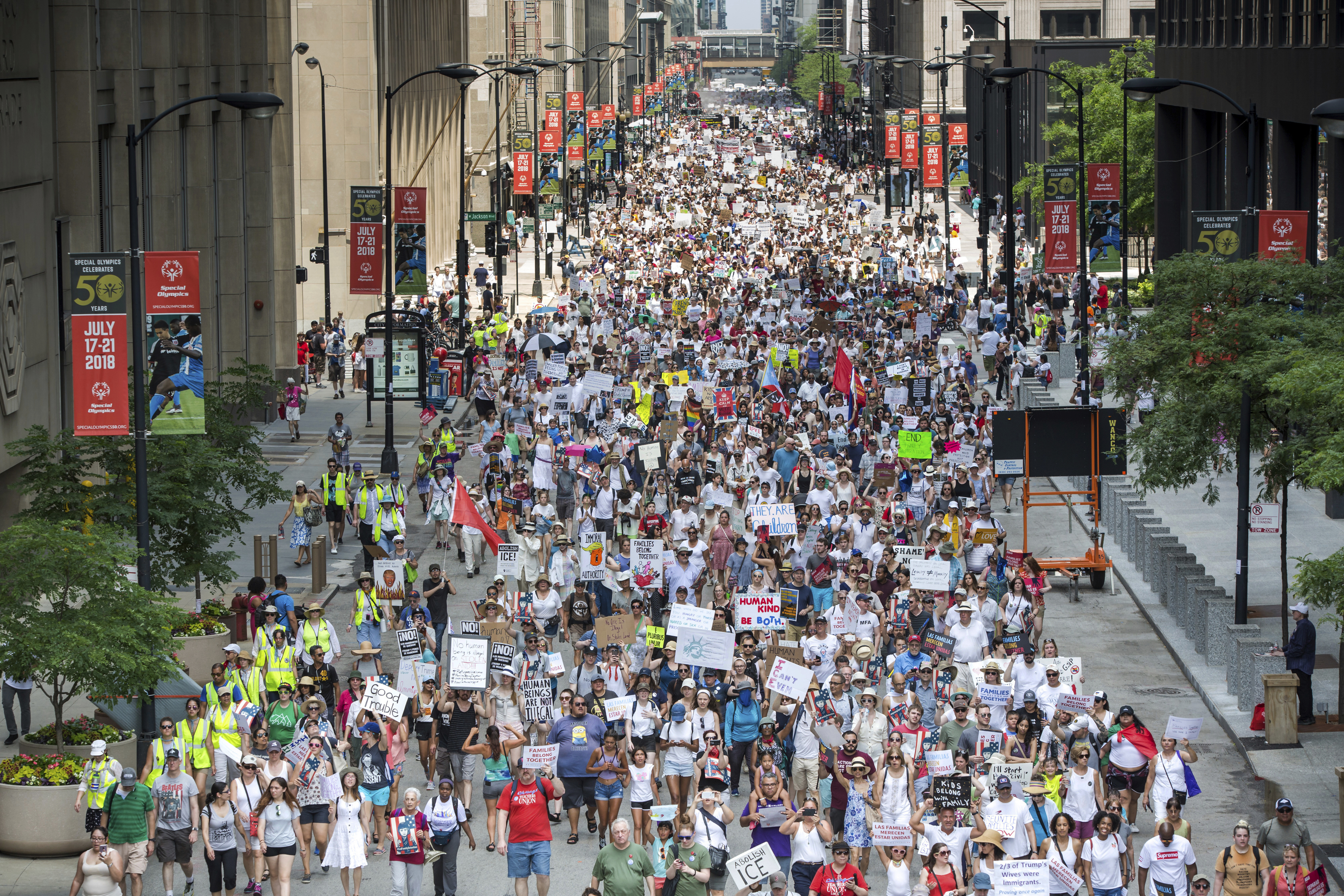 People participate in the Families Belong Together march in Chicago on Saturday, June 30, 2018. In major cities and tiny towns, marchers gathered across America, moved by accounts of children separated from their parents at the U.S.-Mexico border, in the latest act of mass resistance against President Donald Trump's immigration policies. (James Foster/Chicago Sun-Times via AP)