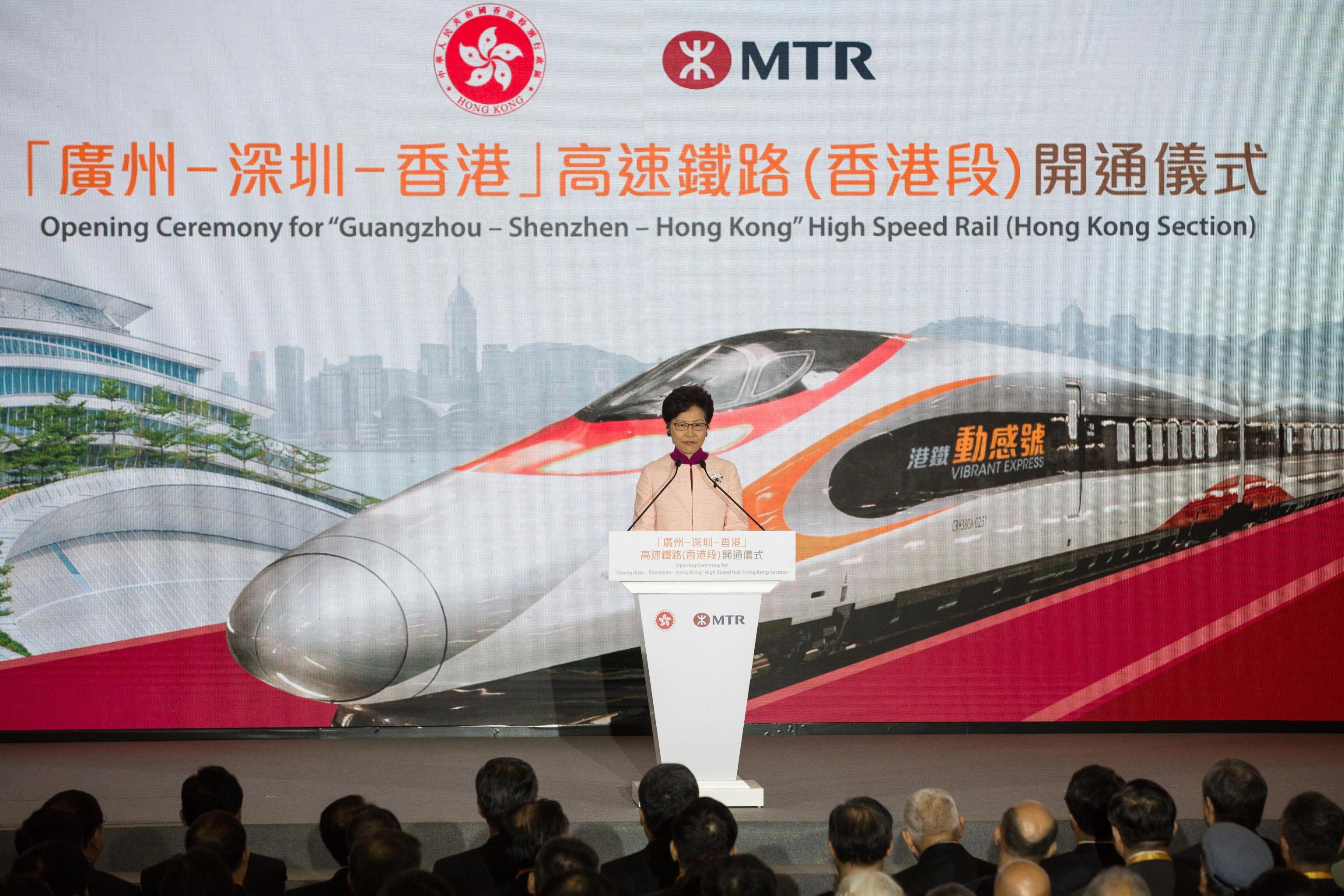 epa07038445 Hong Kong Chief Executive Carrie Lam officiates at the opening ceremony of the Hong Kong section of the Guangzhou-Shenzhen-Hong Kong Express Rail Link at Hong Kong West Kowloon Station in Hong Kong, China, 22 September 2018. After being delayed for three years and overshooting its cost estimate by a third, Hong Kong's cross-border high-speed rail link is finally set to serve its first passengers on 23 September.  EPA/JEROME FAVRE