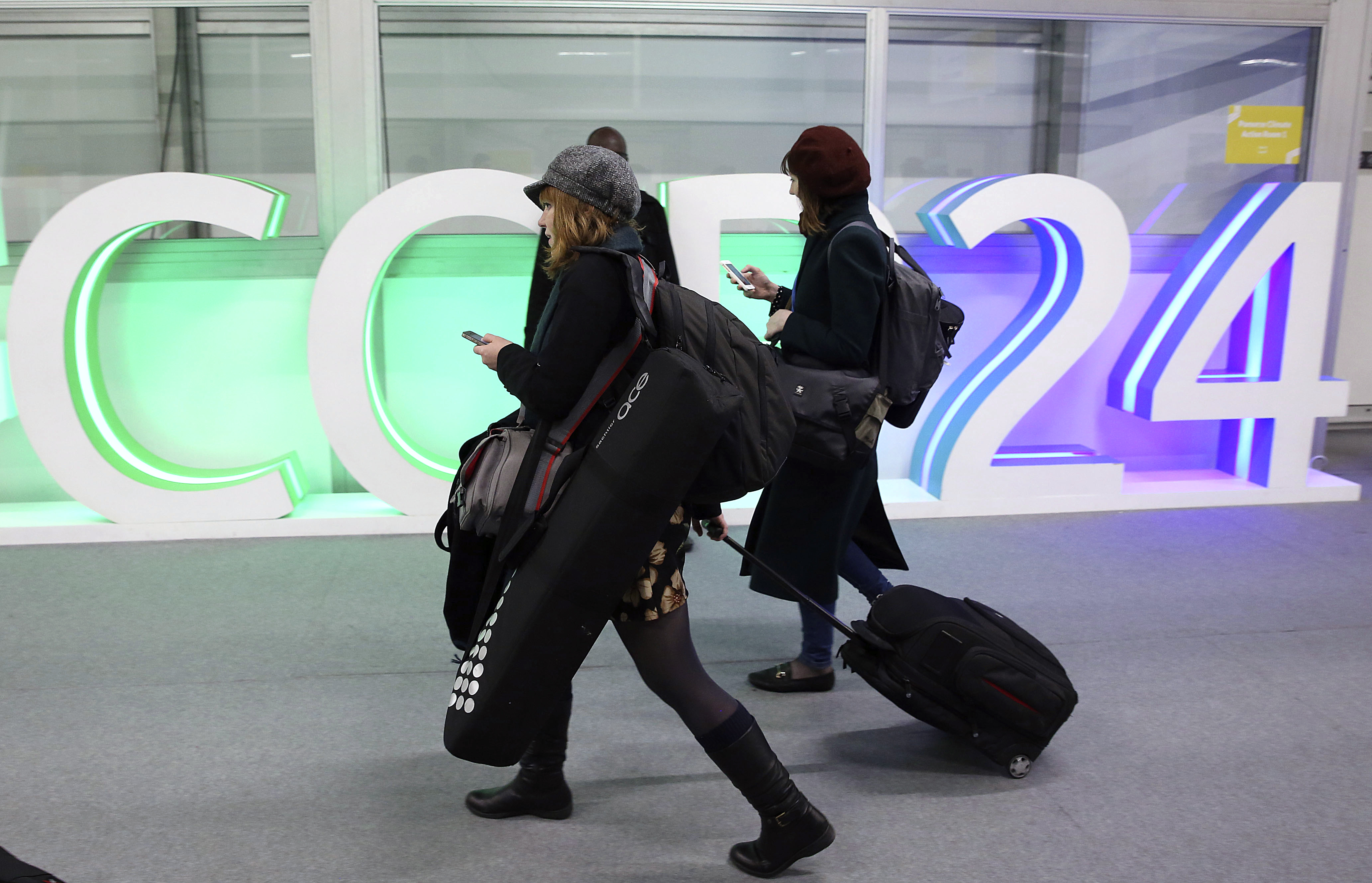 A participants leaves before the end of the final session of the COP24 summit on climate change in Katowice, Poland, Friday, Dec. 14, 2018.(AP Photo/Czarek Sokolowski)