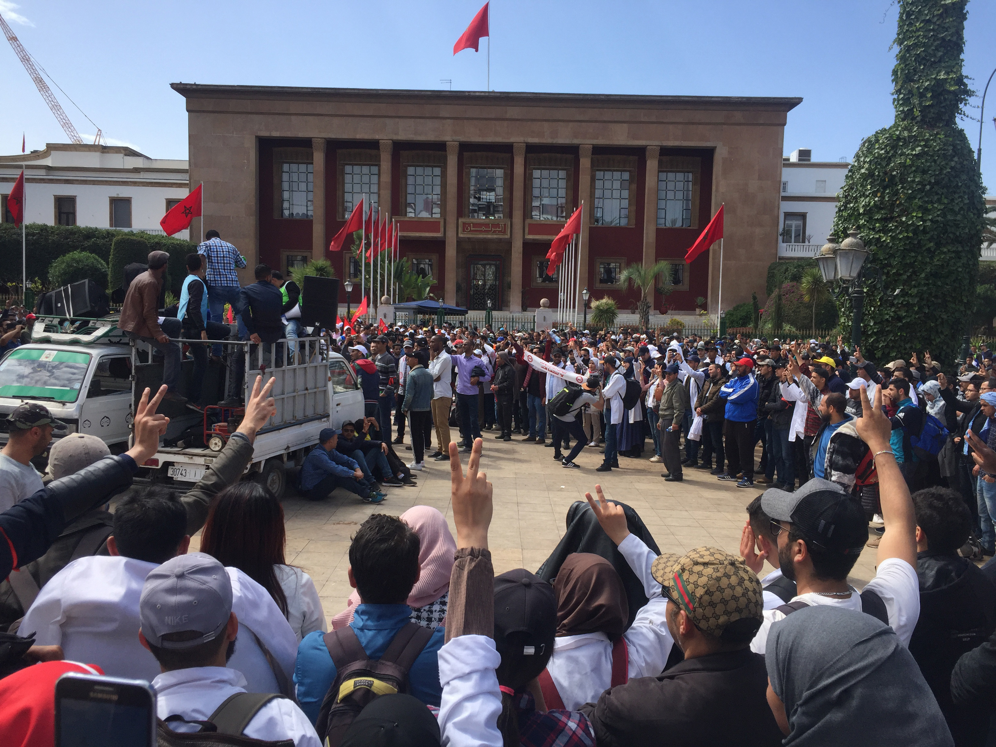 Thousand of Moroccan teachers shout in front of the Moroccan Parliament during a protest and the latest outbreak of anger at low-wage, temporary teaching contracts in Rabat, Morocco, Sunday March 24, 2019. The protesters demand respect for their profession and higher wages.( AP Photo/Amira El Masaiti)