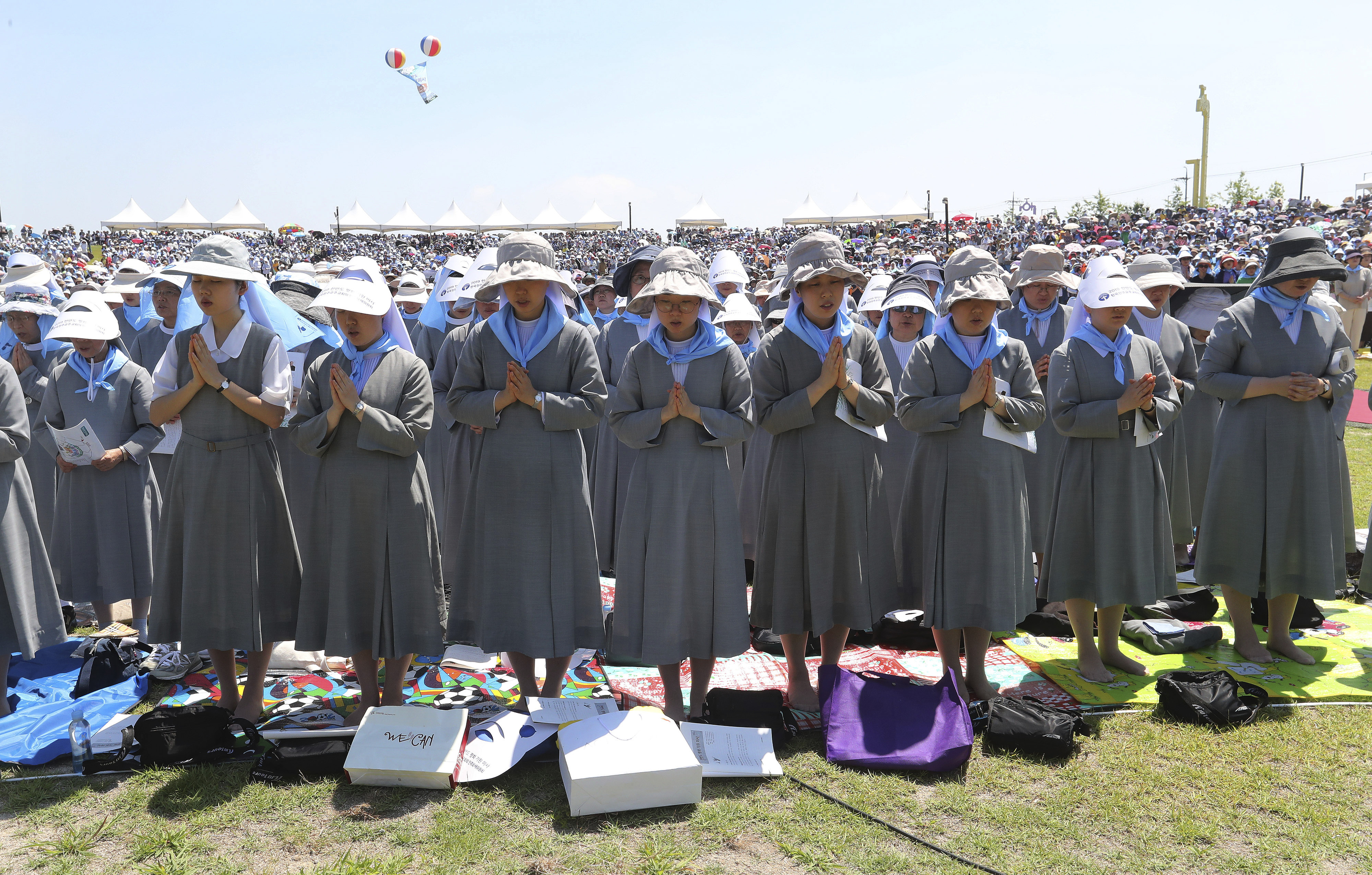 South Korean Catholic nuns pray wishing for peace on the Korean Peninsula during a service to mark the 69th anniversary of the outbreak of the Korean War at the Imjingak Pavilion, near the demilitarized zone of Panmunjom, in Paju, South Korea, Tuesday, June 25, 2019. South Korea and North Korea fought a devastating three-year war in the early 1950s that ended with an armistice, not a peace treaty. (AP Photo/Ahn Young-joon)
