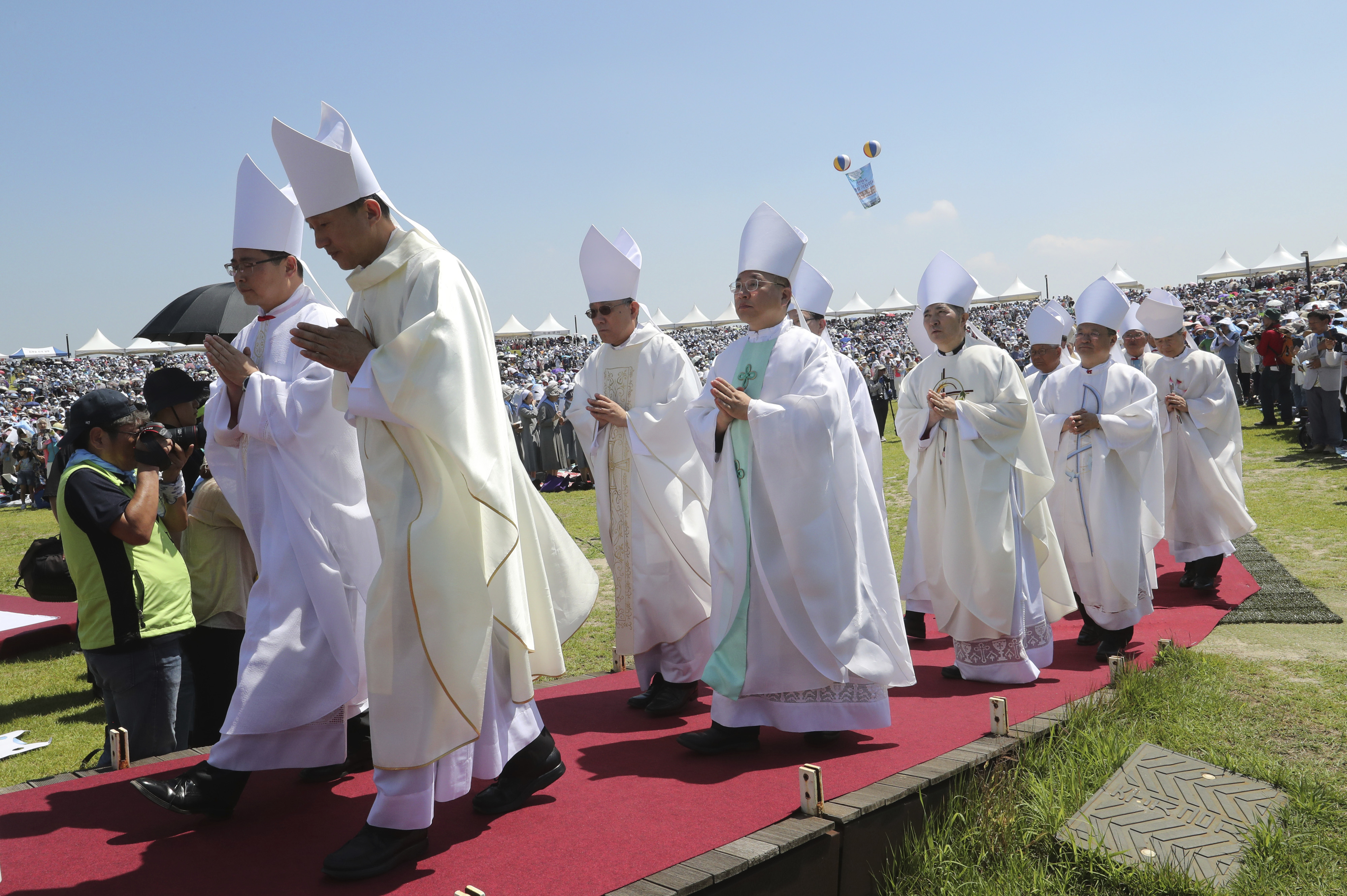South Korean Catholic devotees arrive to attend a service to mark the 69th anniversary of the outbreak of the Korean War at the Imjingak Pavilion, near the demilitarized zone of Panmunjom, in Paju, South Korea, Tuesday, June 25, 2019. South Korea and North Korea fought a devastating three-year war in the early 1950s that ended with an armistice, not a peace treaty. (AP Photo/Ahn Young-joon)