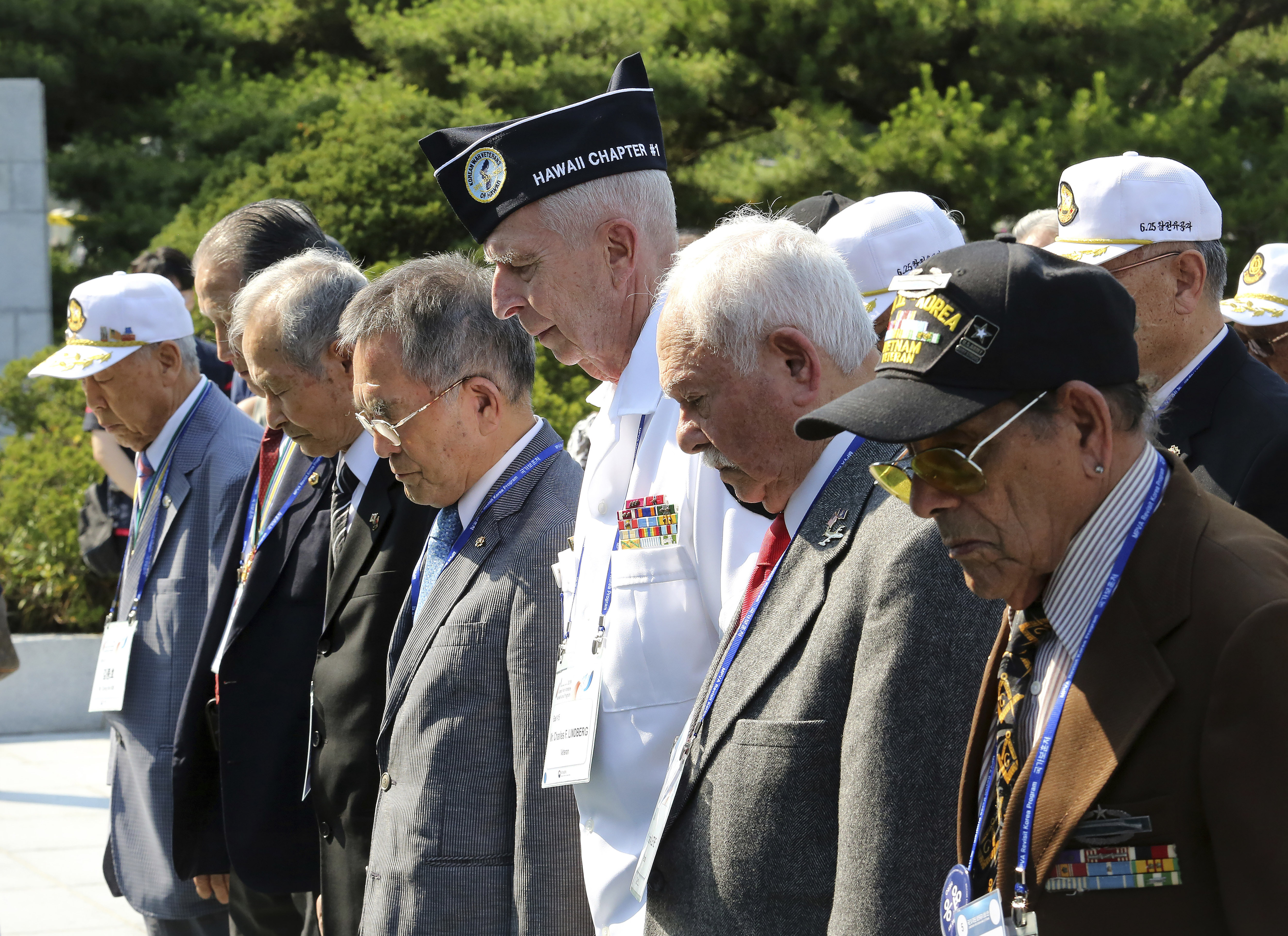 South Korean and U.S. veterans of the Korean War pay their respects to the war dead on the eve of the 69th anniversary of the outbreak of the Korean War at the National Cemetery in Seoul, South Korea, Monday, June 24, 2019. 62 U.S. war veterans and their families, along with 20 Korean veterans and their families residing overseas, arrived on Sunday, June 23, here for a six-day visit to mark the anniversary. (AP Photo/Ahn Young-joon)