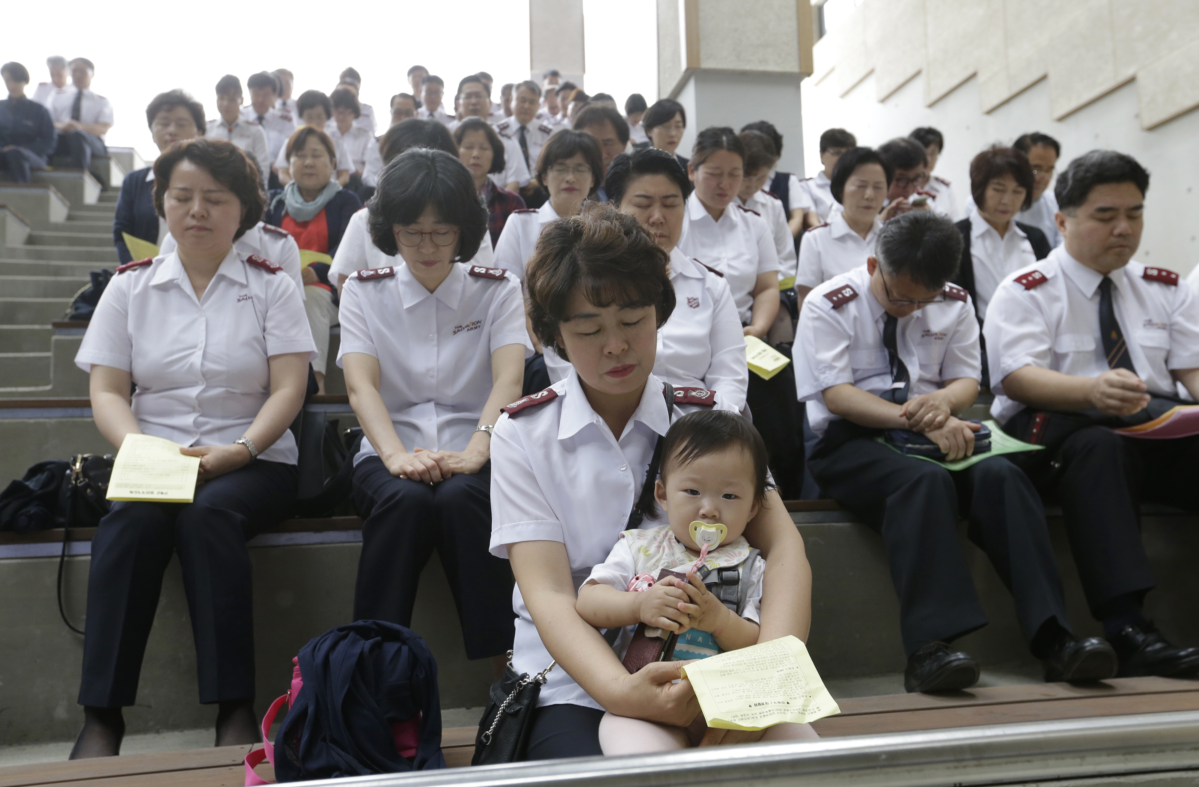 Salvation Army members pray for peace on the Korean peninsula during a service commemorating the 69th anniversary of the Korean War on June 25 at the Imjingak Pavilion, near the demilitarized zone of Panmunjom, in Paju, South Korea, Thursday, June 20, 2019. Chinese President Xi Jinping arrived Thursday morning for a two-day state visit to North Korea, where he's expected to talk with leader Kim Jong Un about the stalled negotiations with Washington over North Korea's nuclear weapons. (AP Photo/Ahn Young-joon)