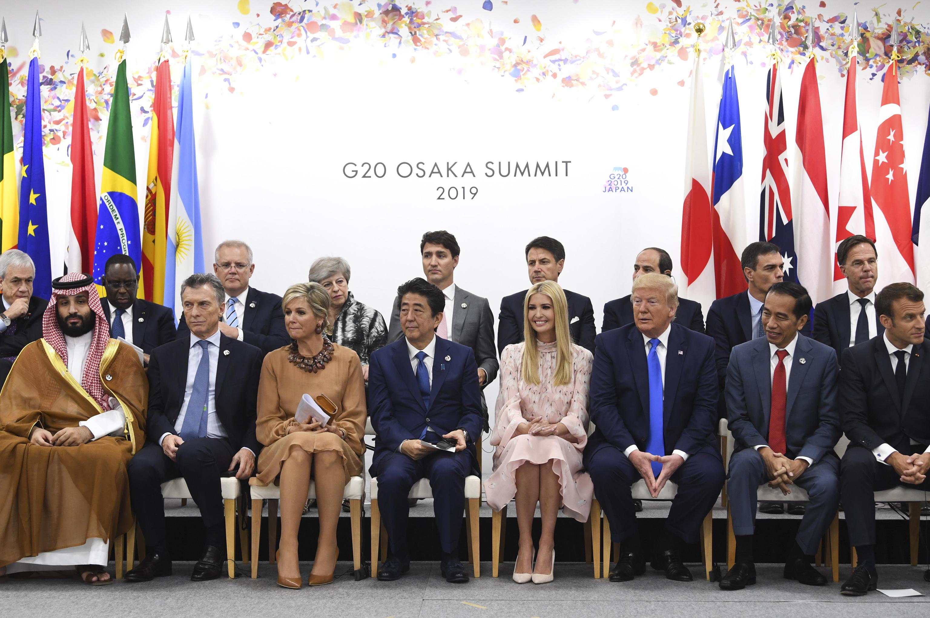 epa07681633 World Leaders pose for a family photo during the Leader's Special event on Women's Empowerment on the second day of the G20 summit in Osaka, Japan, 29 June 2019. It is the first time Japan will host a  summit. The summit gathers leaders from 19 countries and the European Union to discuss topics such as global economy, trade and investment, innovation and employment.  EPA/LUKAS COCH  AUSTRALIA AND NEW ZEALAND OUT