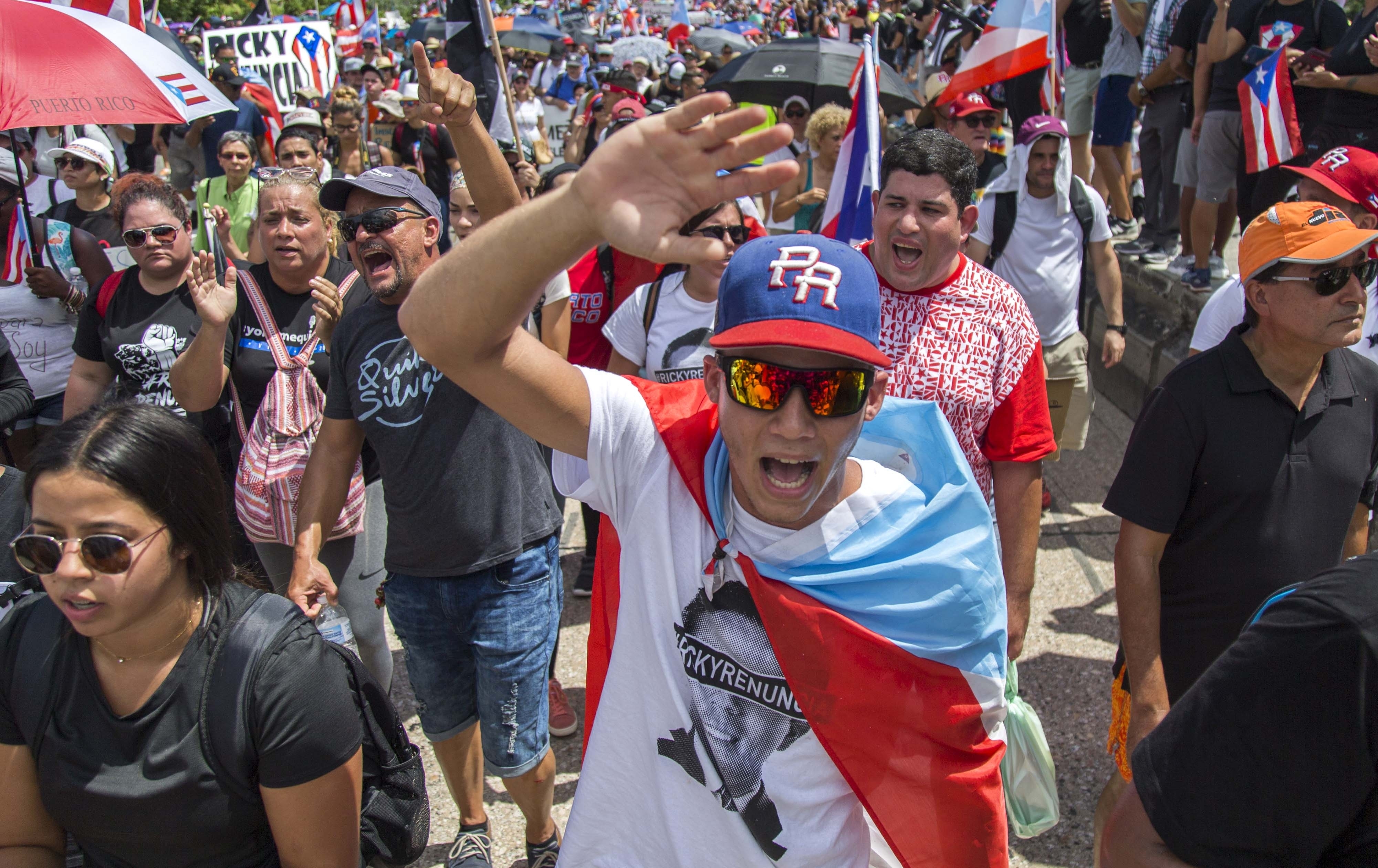 Demonstrators march on Las Americas highway demanding the resignation of governor Ricardo Rossello, in San Juan, Puerto Rico, Monday, July 22, 2019. Protesters are demanding Rossello step down for his involvement in a private chat in which he used profanities to describe an ex-New York City councilwoman and a federal control board overseeing the island's finance. (AP Photo / Dennis M. Rivera Pichardo)