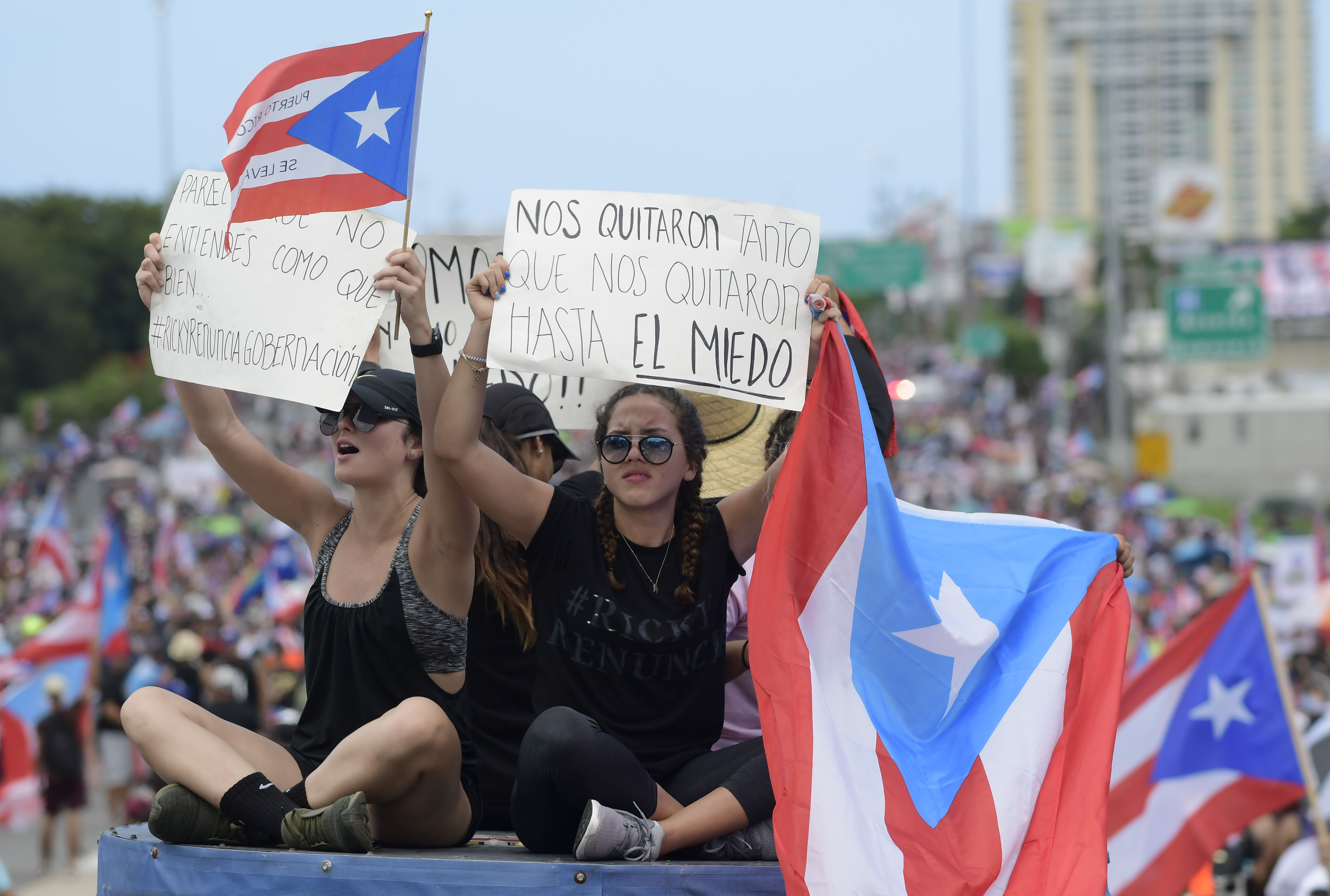 Demonstrators protest demanding the resignation of governor Ricardo Rossello in San Juan, Puerto Rico, Monday, July 22, 2019. Protesters are demanding Rossello step down for his involvement in a private chat in which he used profanities to describe an ex-New York City councilwoman and a federal control board overseeing the island's finance. (AP Photo/Carlos Giusti)
