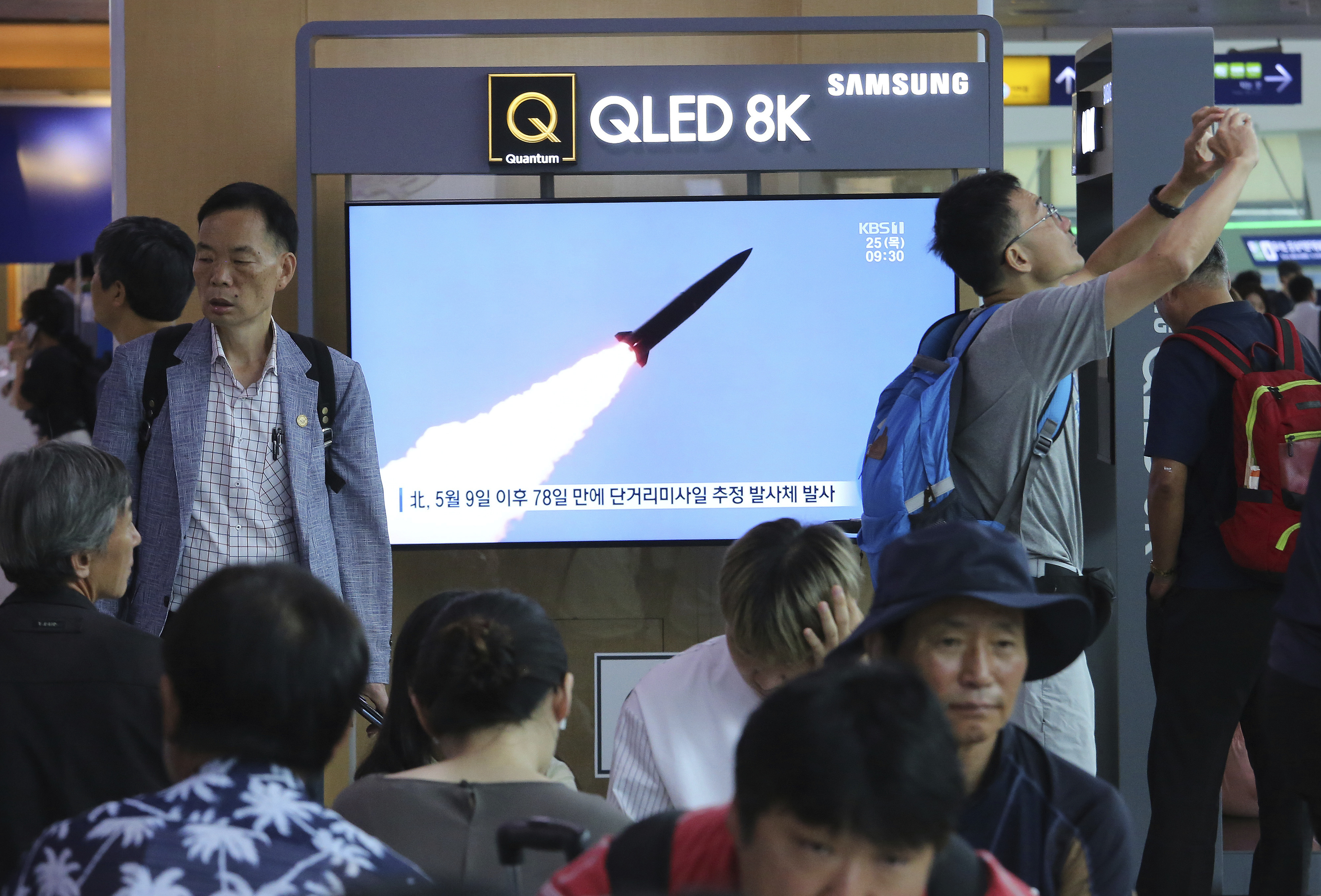 A TV screen shows a file image of North Korea's missile launch during a news program at the Seoul Railway Station in Seoul, South Korea, Thursday, July 25, 2019. North Korea fired two unidentified projectiles into the sea on Thursday, South Korea's military said, the first launches in more than two months as North Korean and U.S. officials struggle to restart nuclear diplomacy. The signs read: 