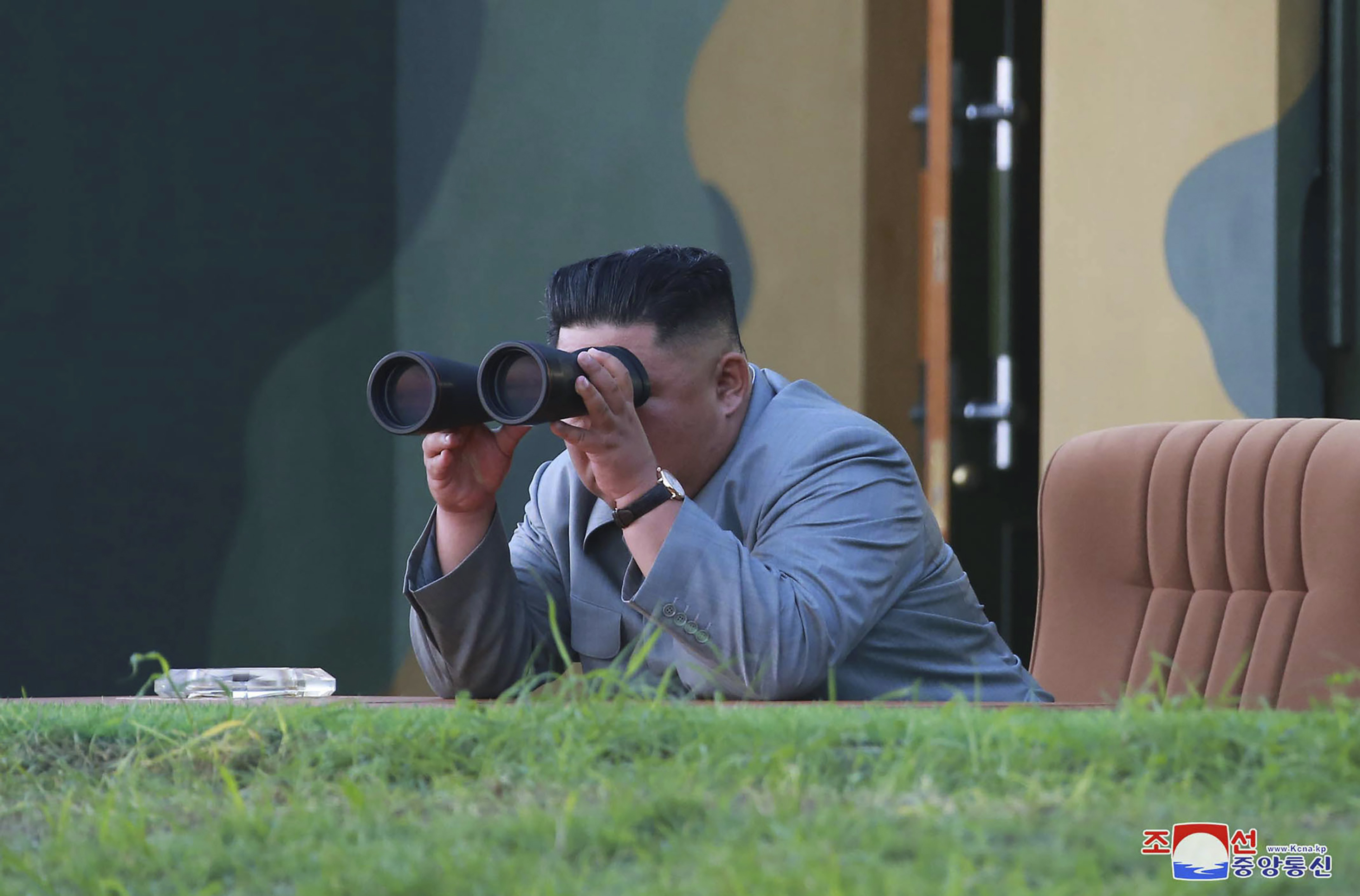 In this Thursday, July 25, 2019, photo provided on Friday, July 26, 2019, by the North Korean government, North Korean leader Kim Jong Un watches a missile test in North Korea.  A day after two North Korean missile launches rattled Asia, the nation announced Friday that its leader Kim supervised a test of a new-type tactical guided weapon that was meant to be a 