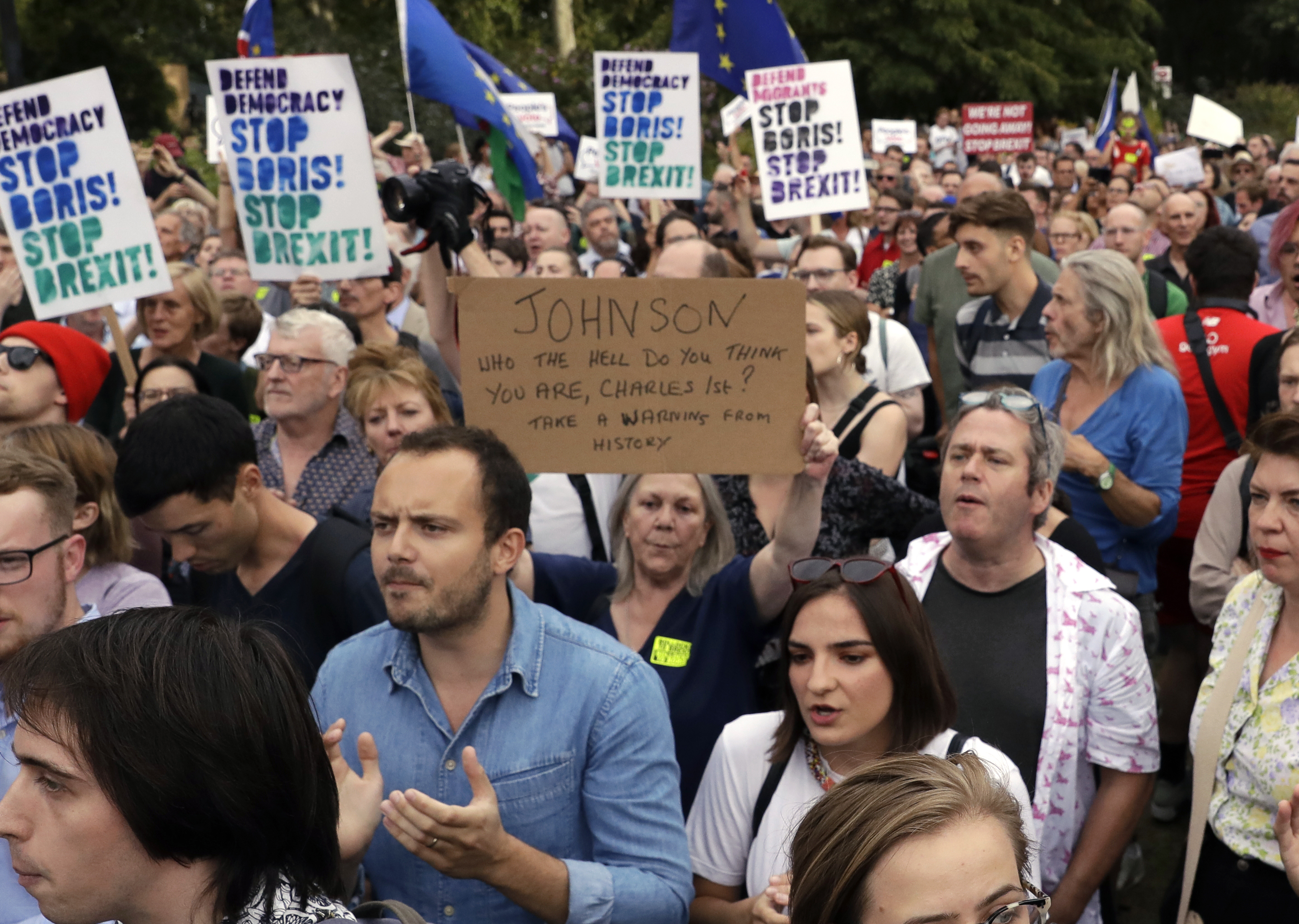 Anti-Brexit supporters take part in a protest at College Green near the Houses of Parliament in central London, Wednesday, Aug. 28, 2019. British Prime Minister Boris Johnson maneuvered Wednesday to give his political opponents even less time to block a no-deal Brexit before the Oct. 31 withdrawal deadline, winning Queen Elizabeth II's approval to suspend Parliament. (AP Photo/Matt Dunham)