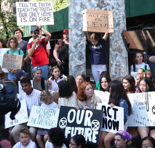 Swedish environmental activist Greta Thunberg, center, second row, participates in a Youth Climate Strike outside the United Nations, Friday, Aug. 30, 2019. Thunberg is scheduled to address the United Nations Climate Action Summit on September 23. (AP Photo/Bebeto Matthews)