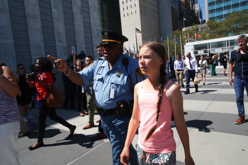 Swedish environmental activist Greta Thunberg walks into the United Nations, Friday, Aug. 30, 2019. Thunberg is scheduled to address the United Nations Climate Action Summit on September 23. (AP Photo/Mary Altaffer)