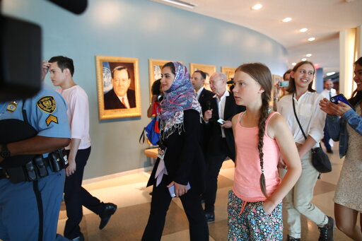 Swedish environmental activist Greta Thunberg walks into the United Nations, Friday, Aug. 30, 2019. Thunberg is scheduled to address the United Nations Climate Action Summit on September 23. (AP Photo/Mary Altaffer)