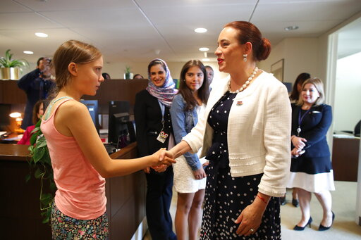 CORRECTS ID TO U.N. GENERAL ASSEMBLY PRESIDENT MARÍA FERNANDA ESPINOSA GARCES, NOT TIJJANI MUHAMMAD-BANDE - Swedish environmental activist Greta Thunberg, left, is greeted by U.N. General Assembly President María Fernanda Espinosa Garces as she arrives in the United Nations, Friday, Aug. 30, 2019. Thunberg is scheduled to address the United Nations Climate Action Summit on September 23. (AP Photo/Mary Altaffer)
