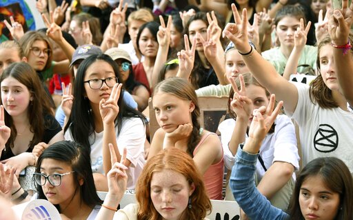 Swedish teen activist Greta Thunberg (C) holds a protest together with hundreds of youths in front of U.N. headquarters in New York on Aug. 30, 2019, calling for action to address climate change. (Kyodo via AP Images) ==Kyodo